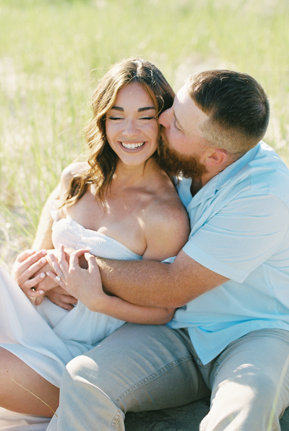 couple sitting in the sand