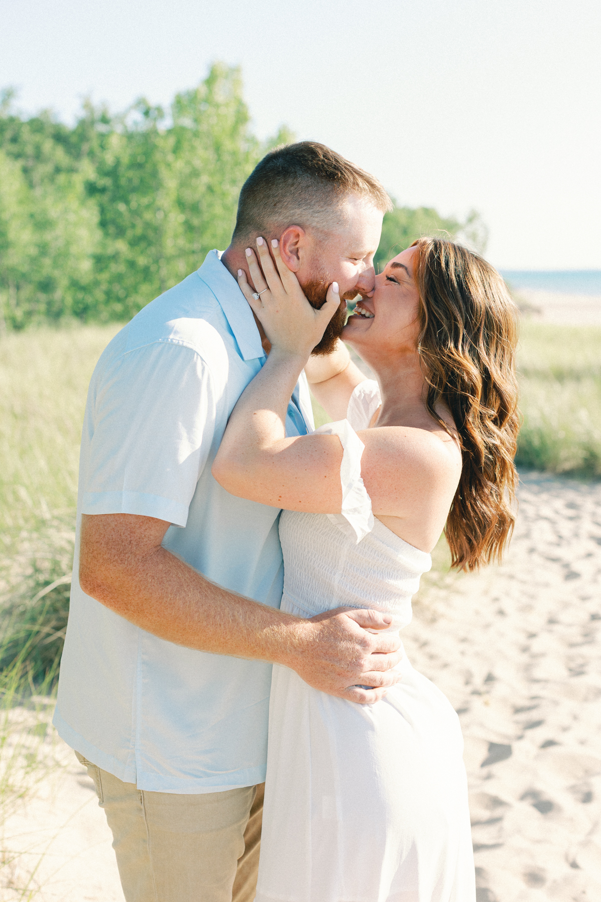couple laughing and kissing