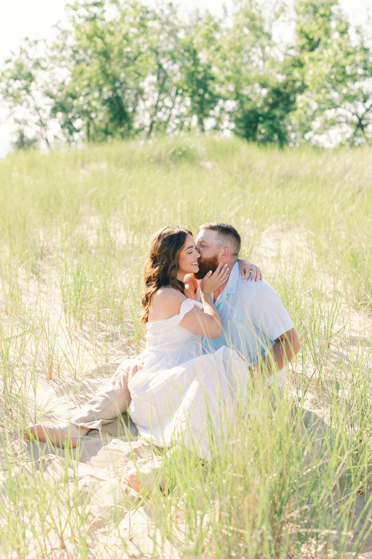 couple sitting in sand