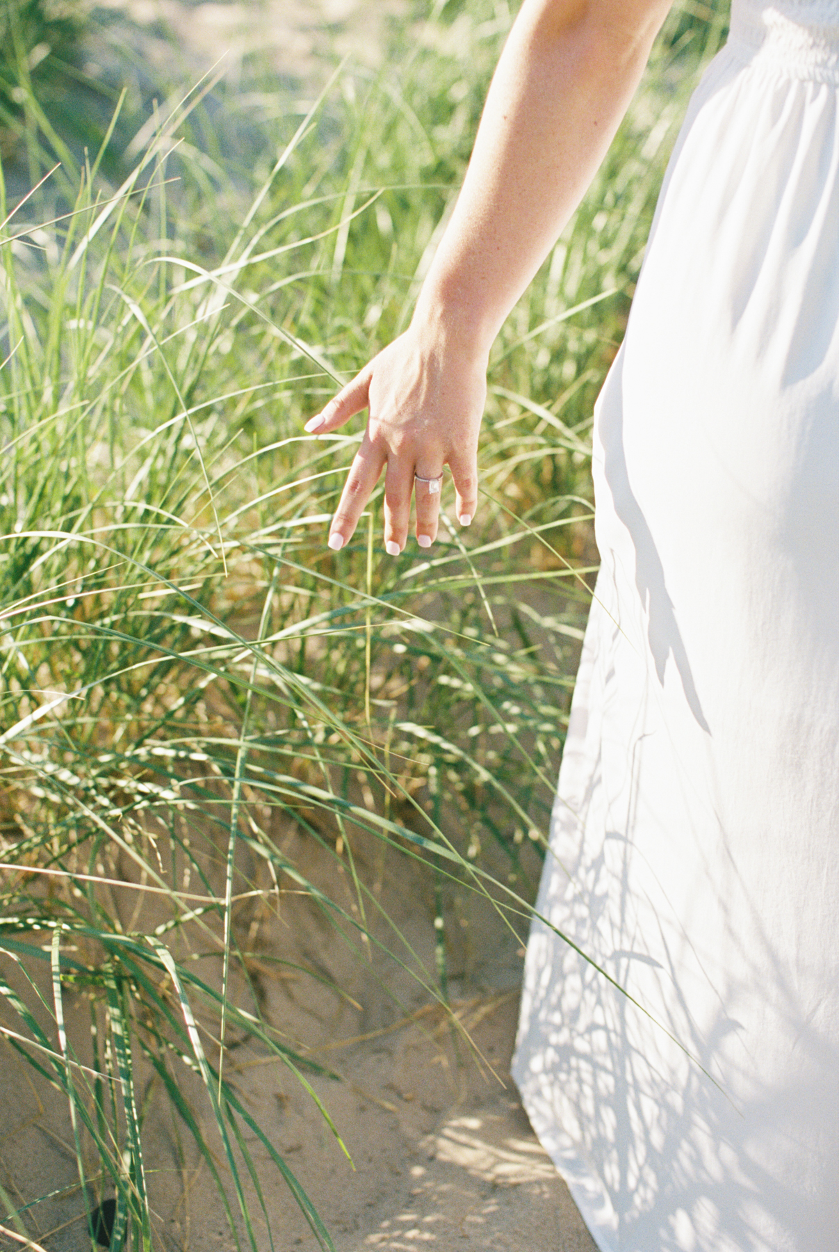 brides hand in grass
