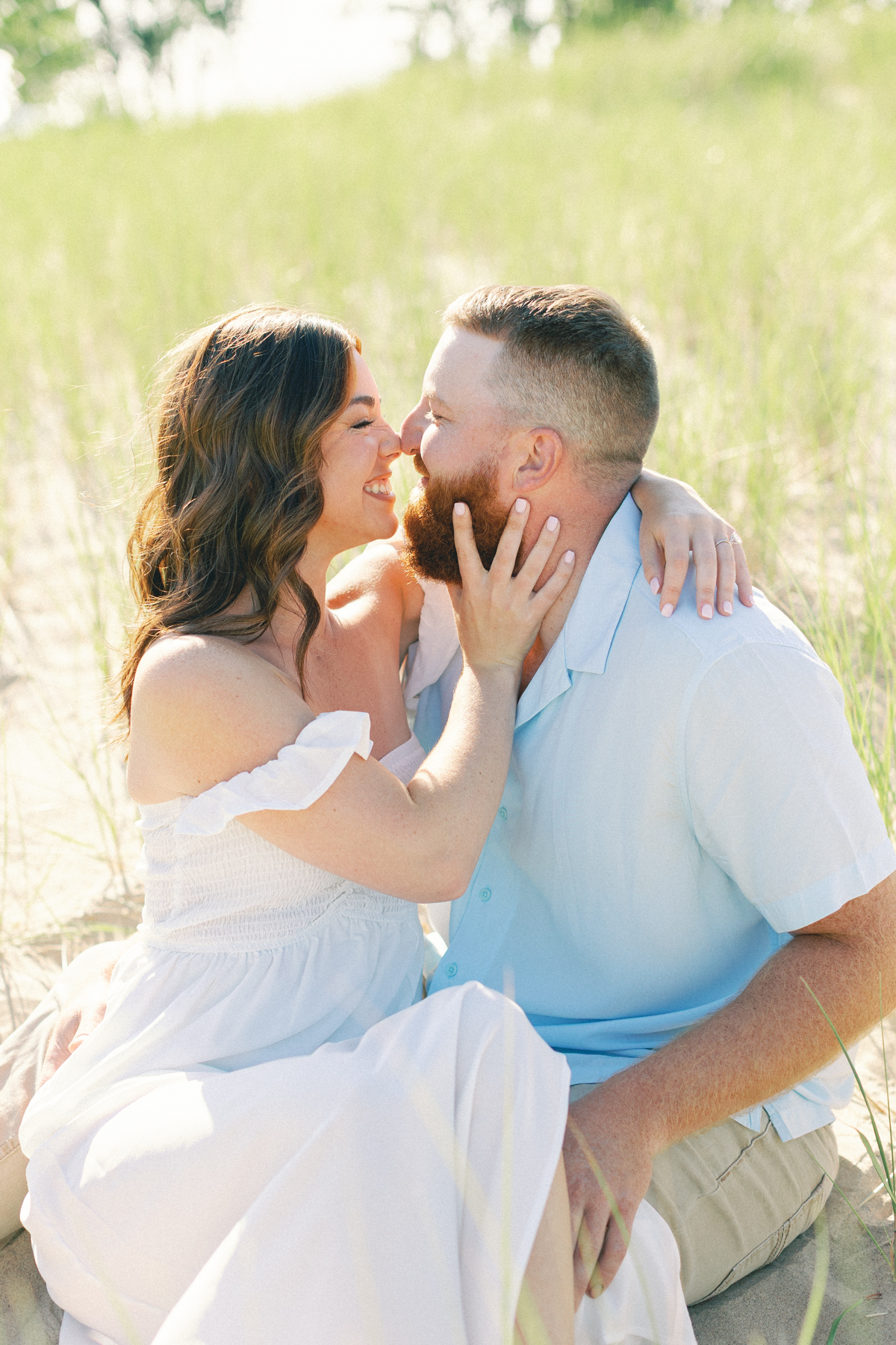 couple sitting in the sand