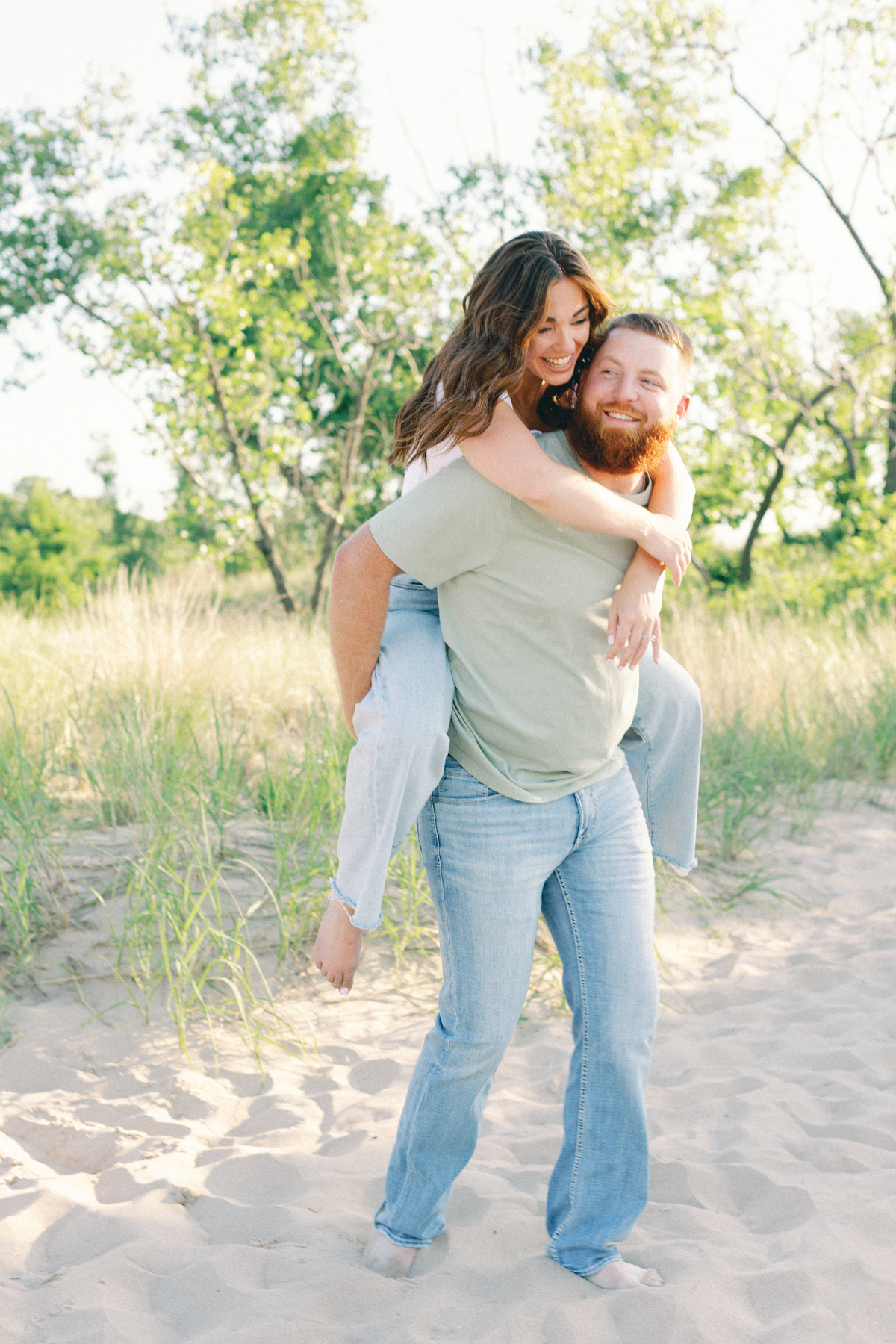 couple laughing on his back