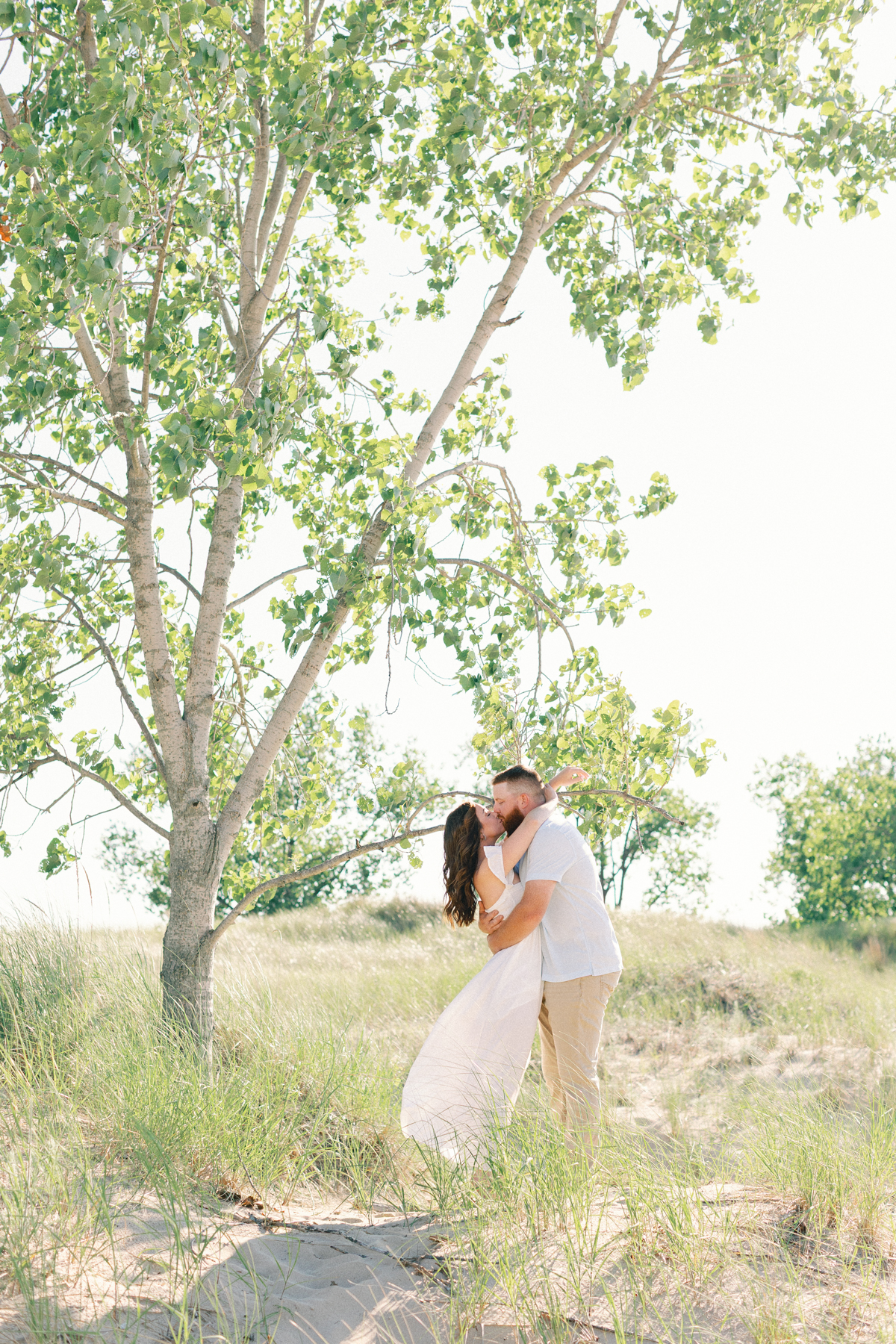 couple in front of tree