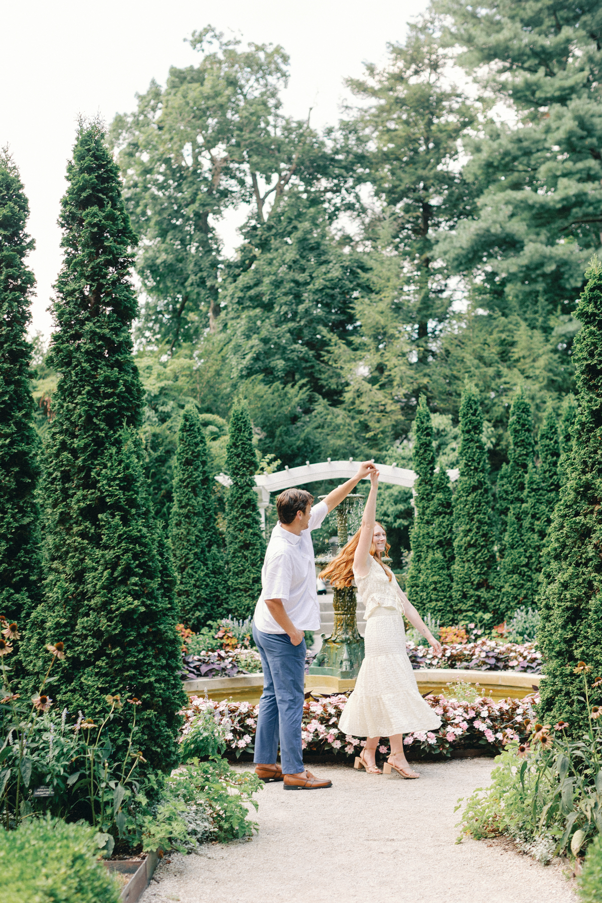  couple twirling in the Garden