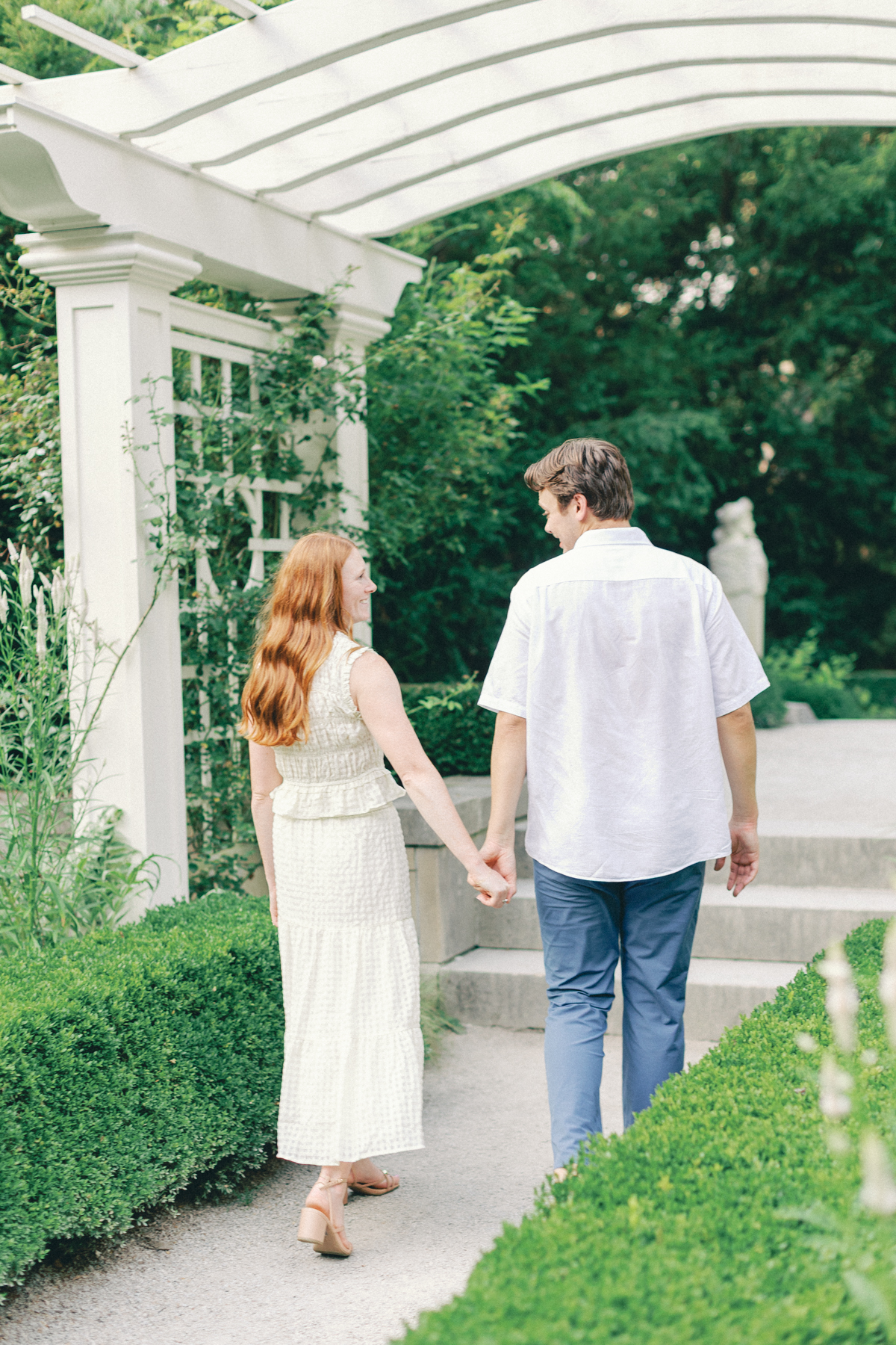  couple walking out of garden