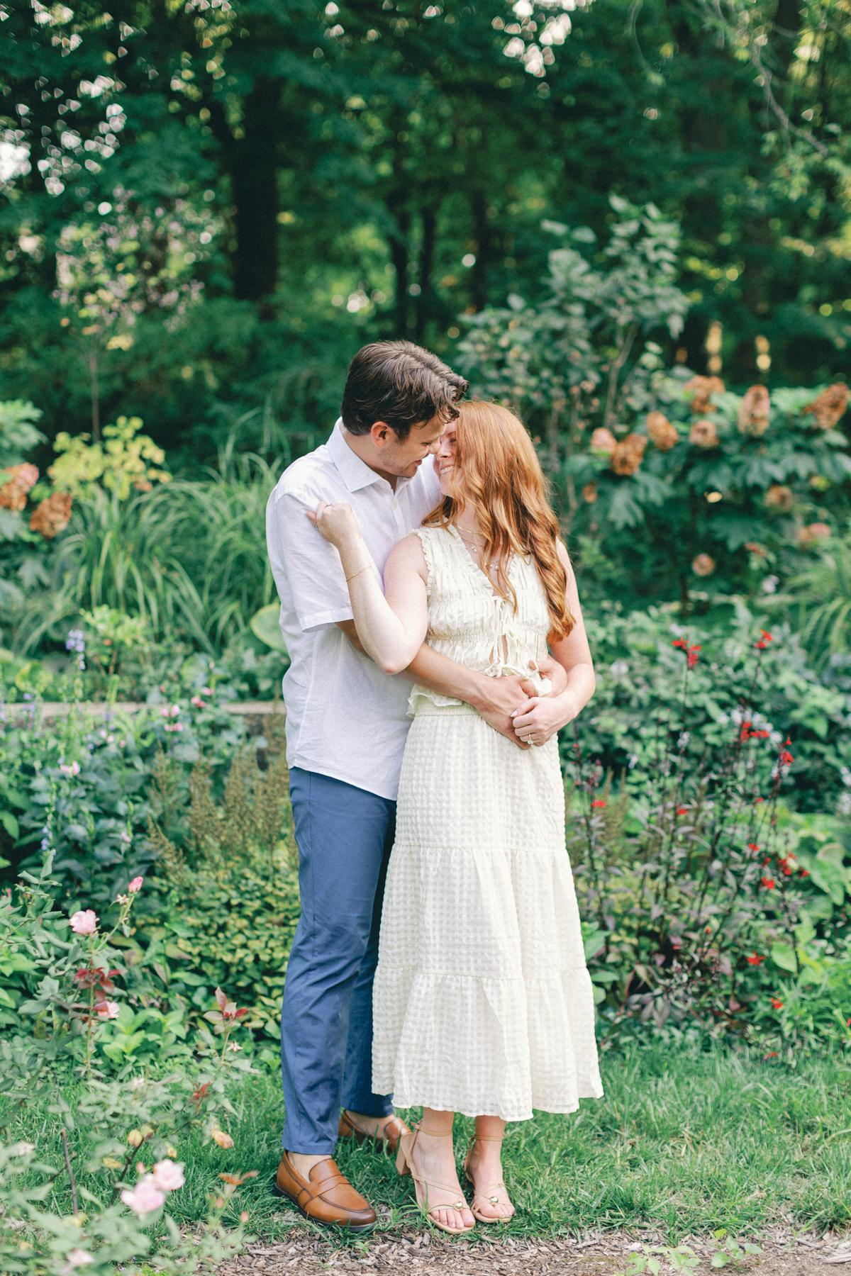  couple cuddling in the garden