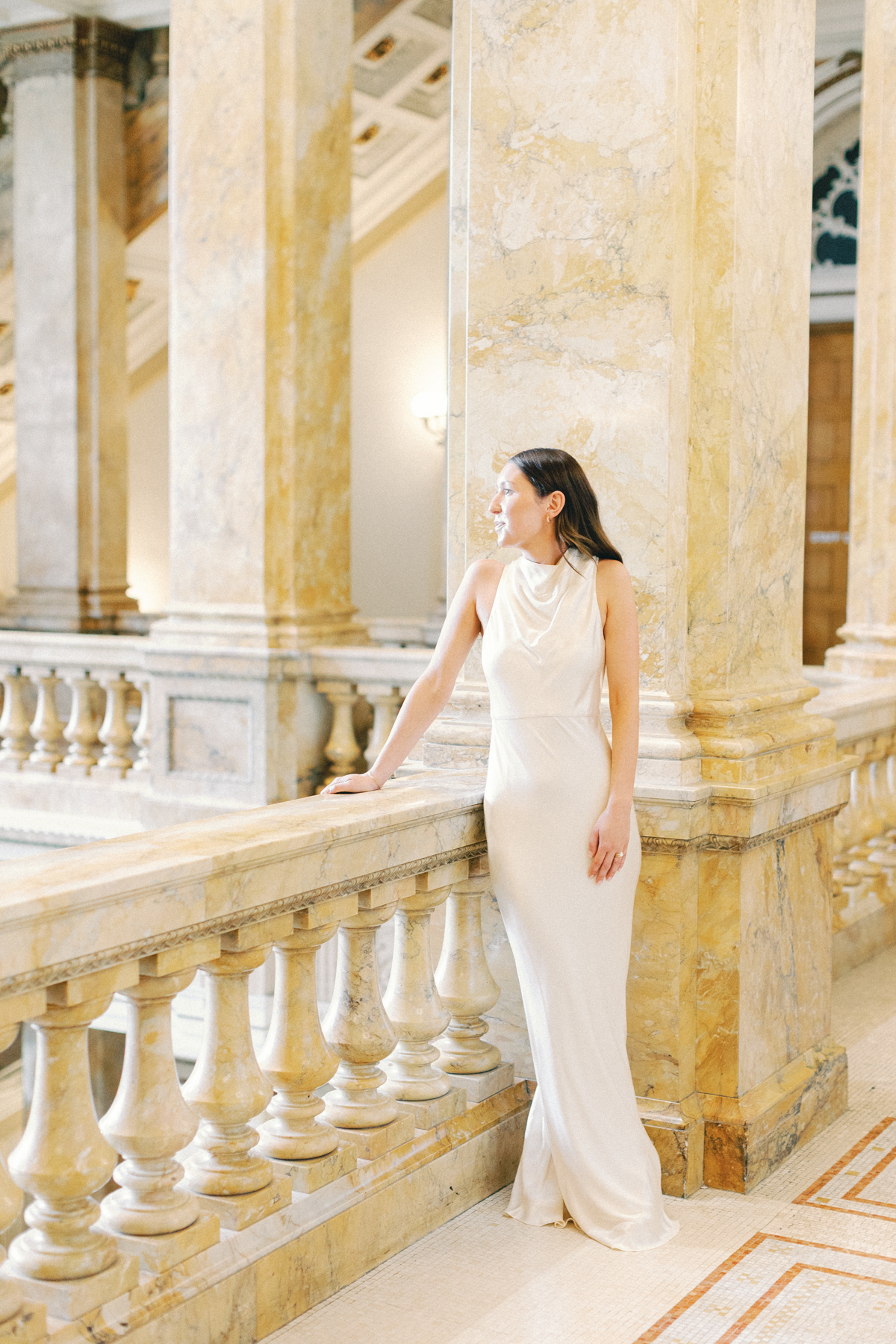 Bride looking out at library