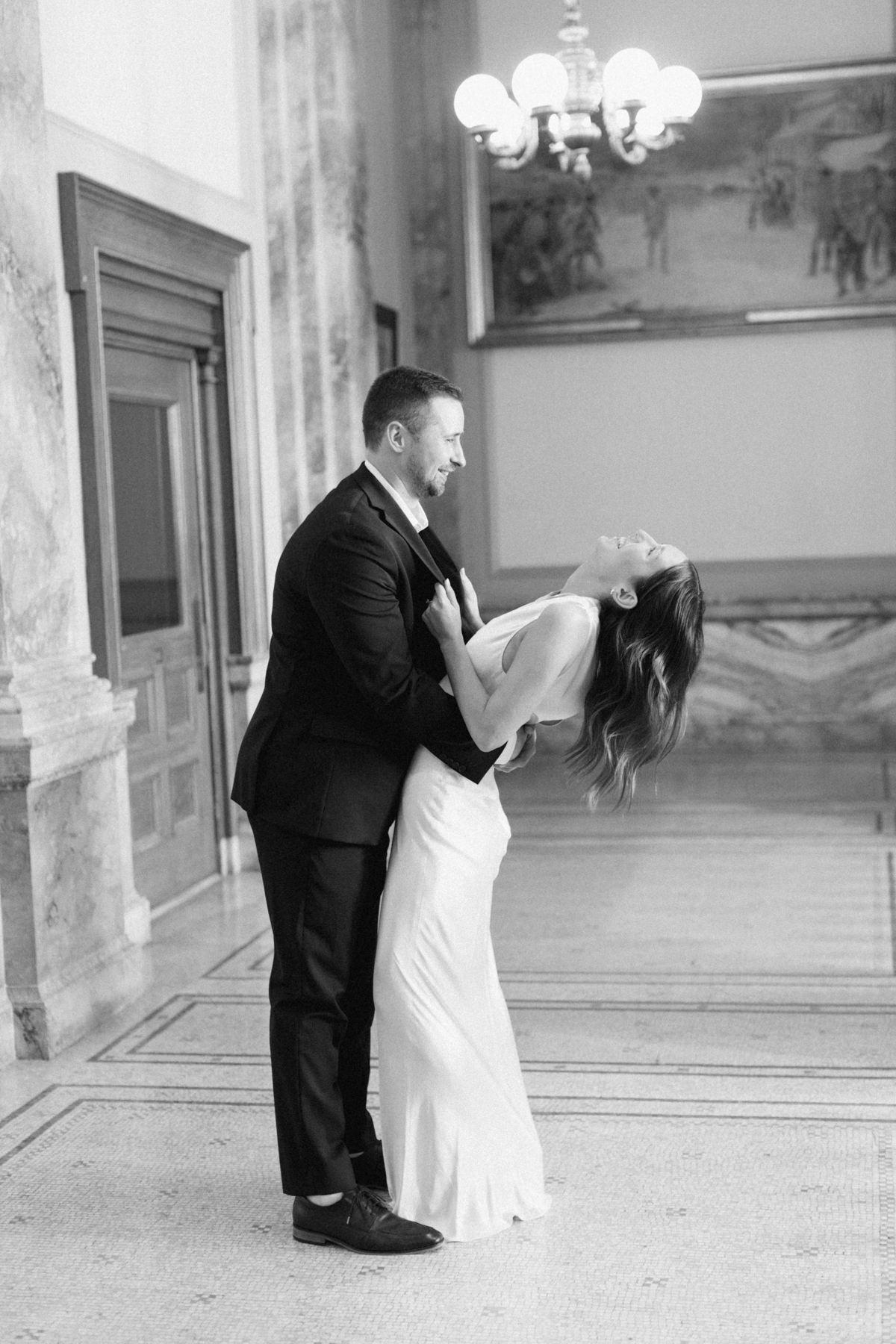 Groom, dipping bride