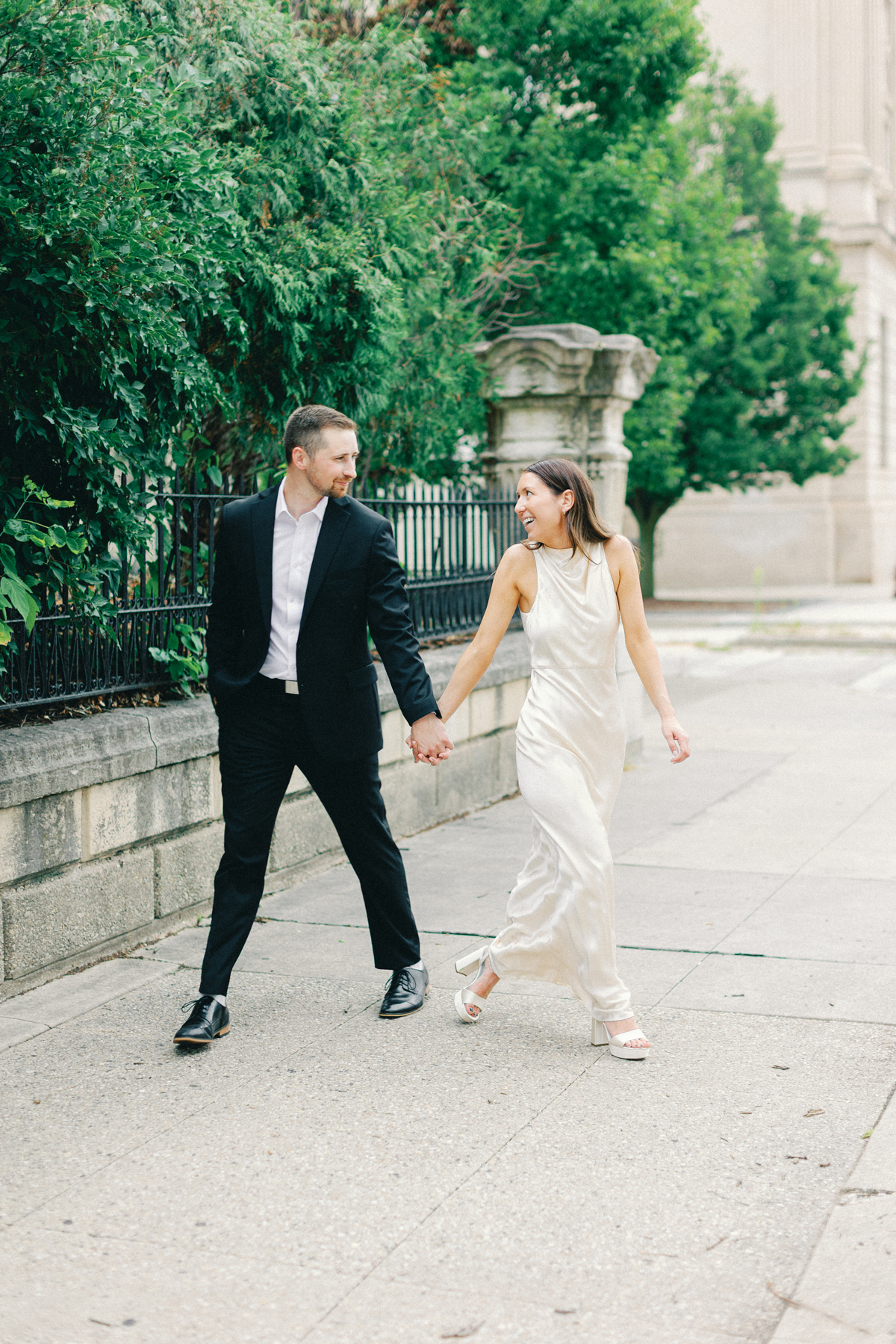 Couple walking outside on the sidewalk