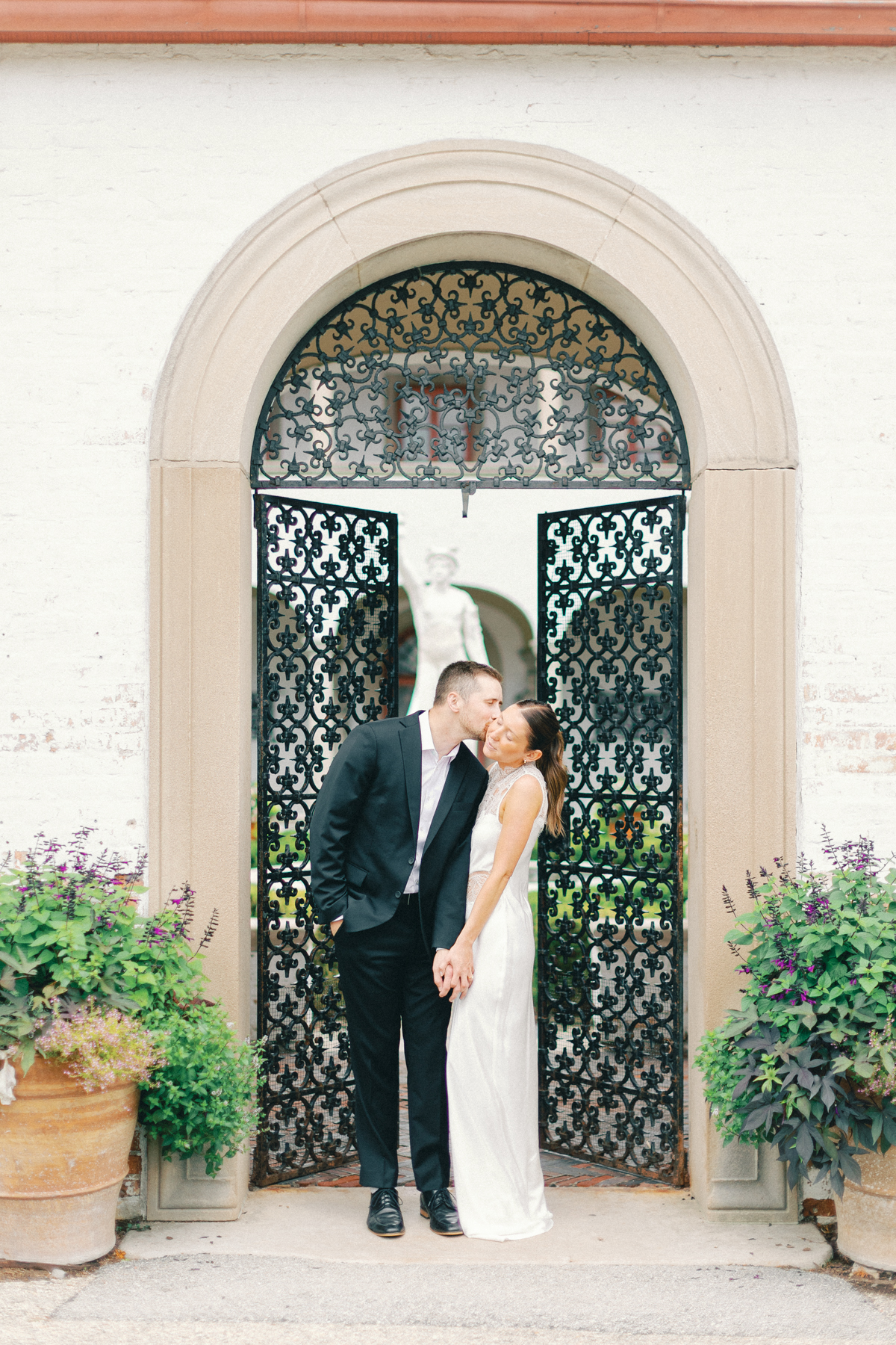 Couple in front of iron door