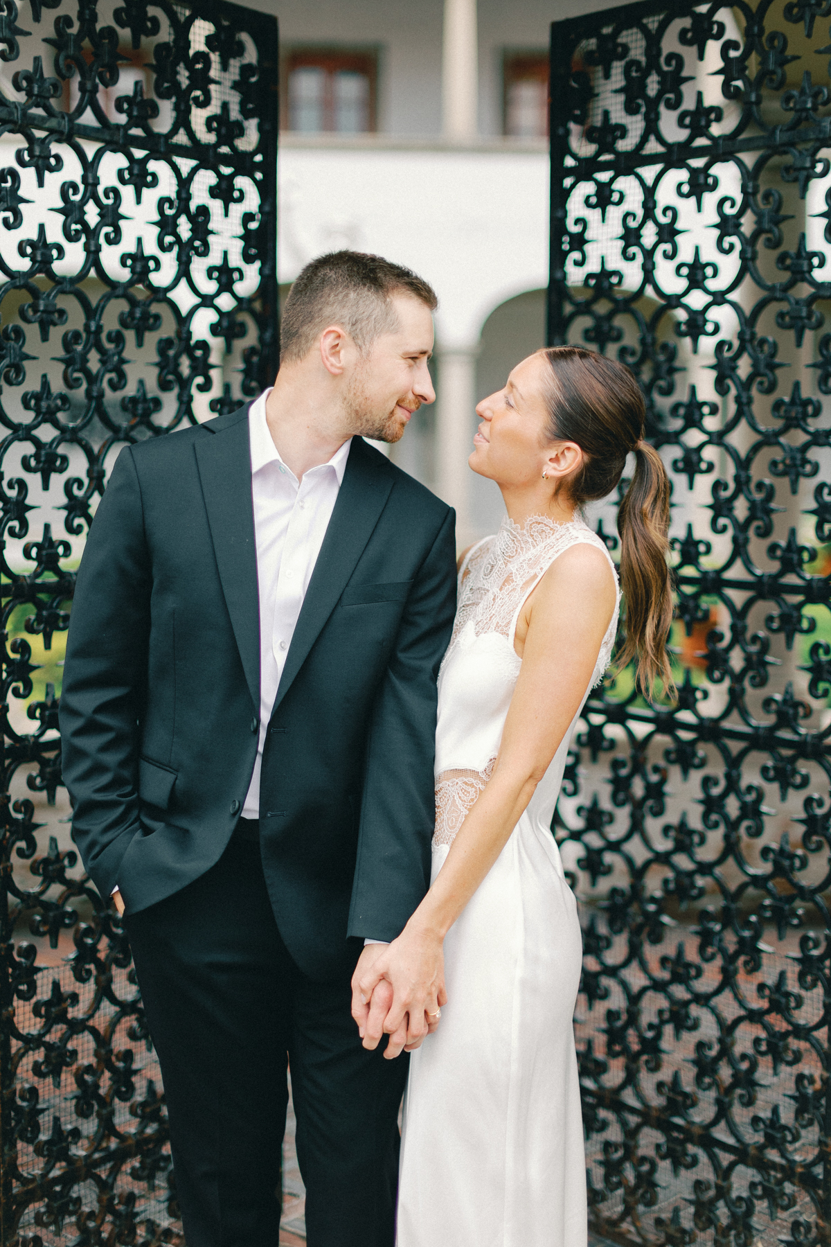 Couple holding hands looking at each other