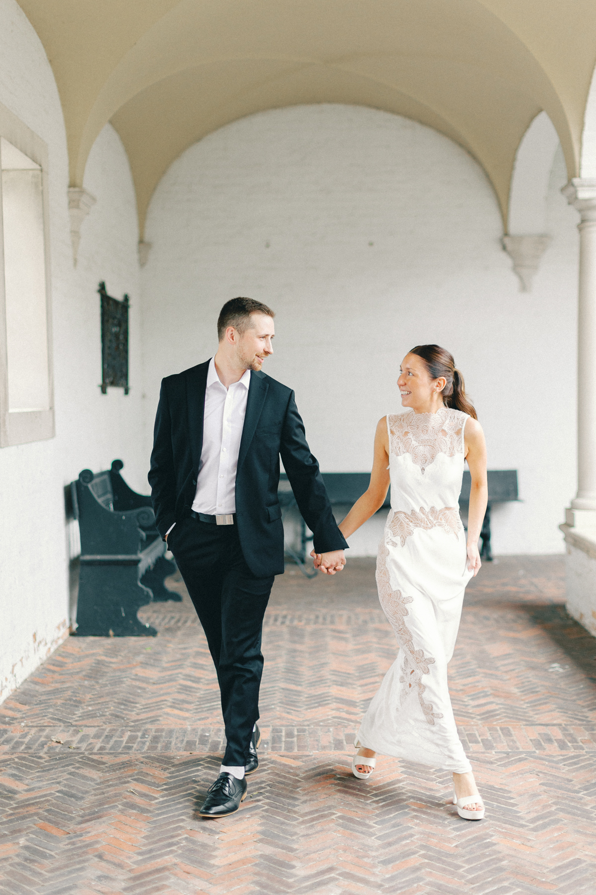 Couple walking in hallway outside