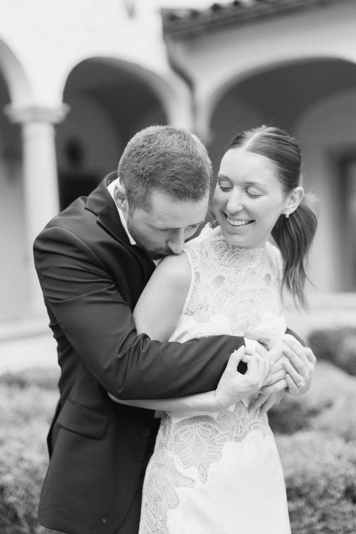 Black-and-white photo of couple laughing