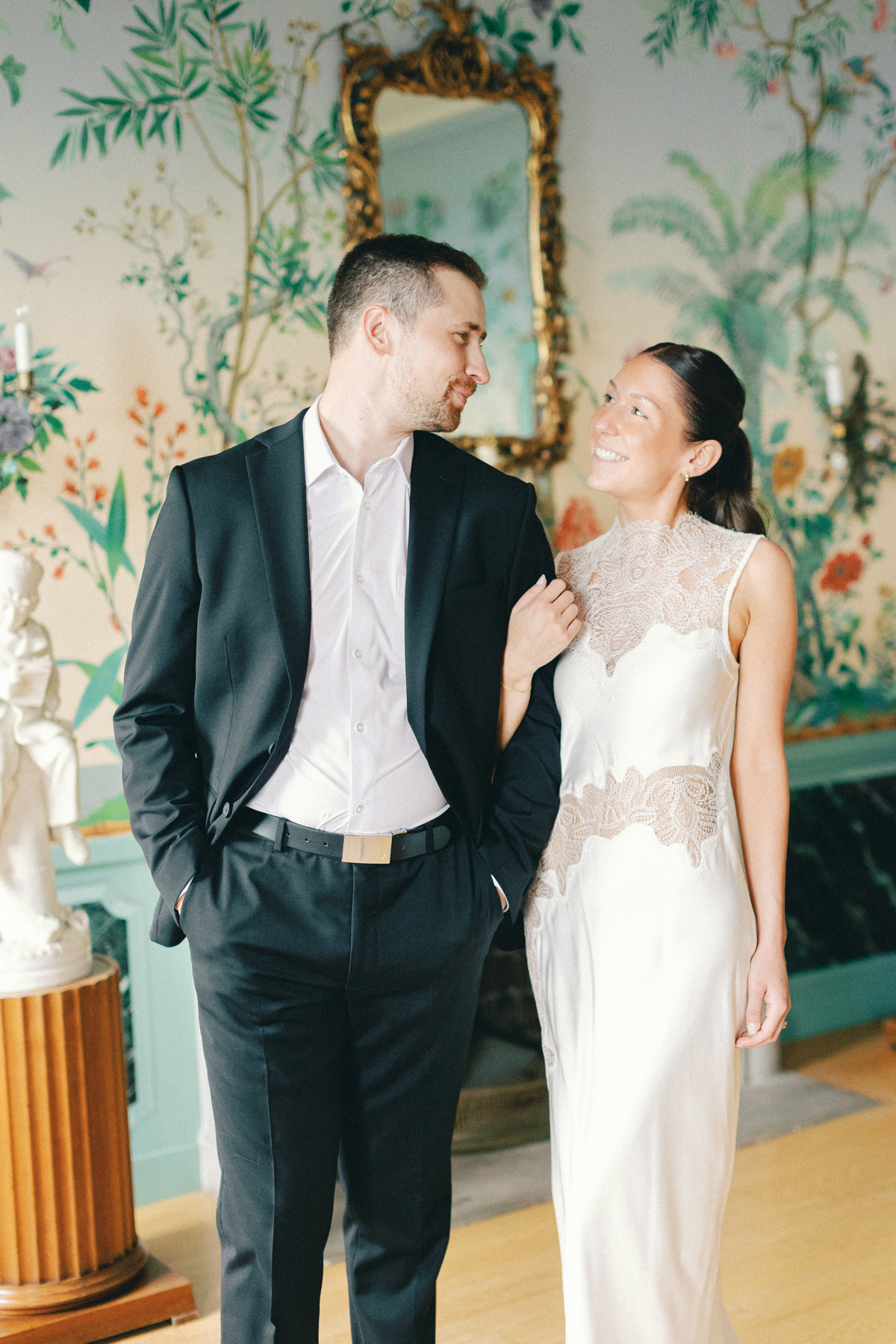 Couple inside, looking at each other