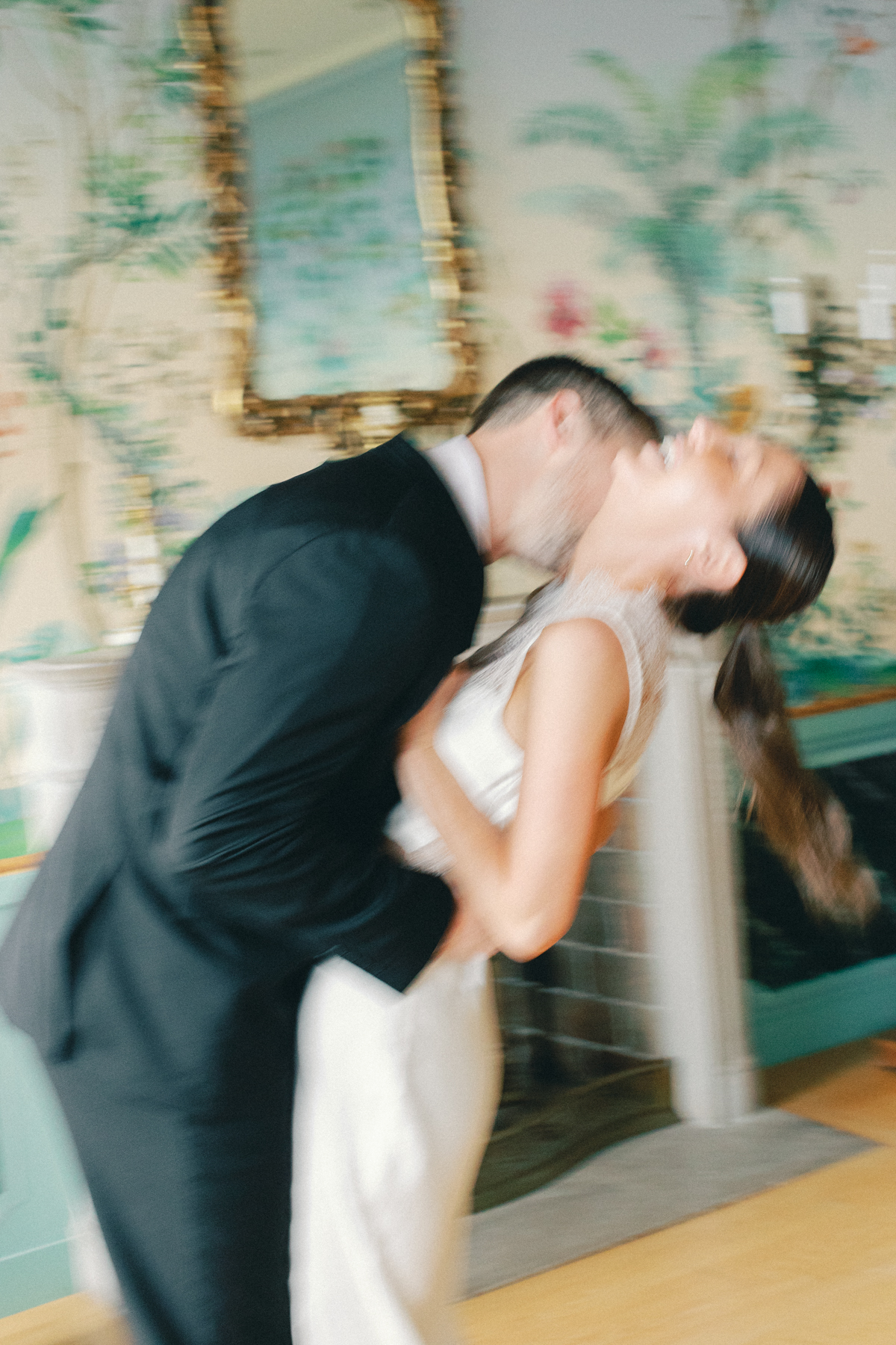 Motion blur photo of him, kissing her