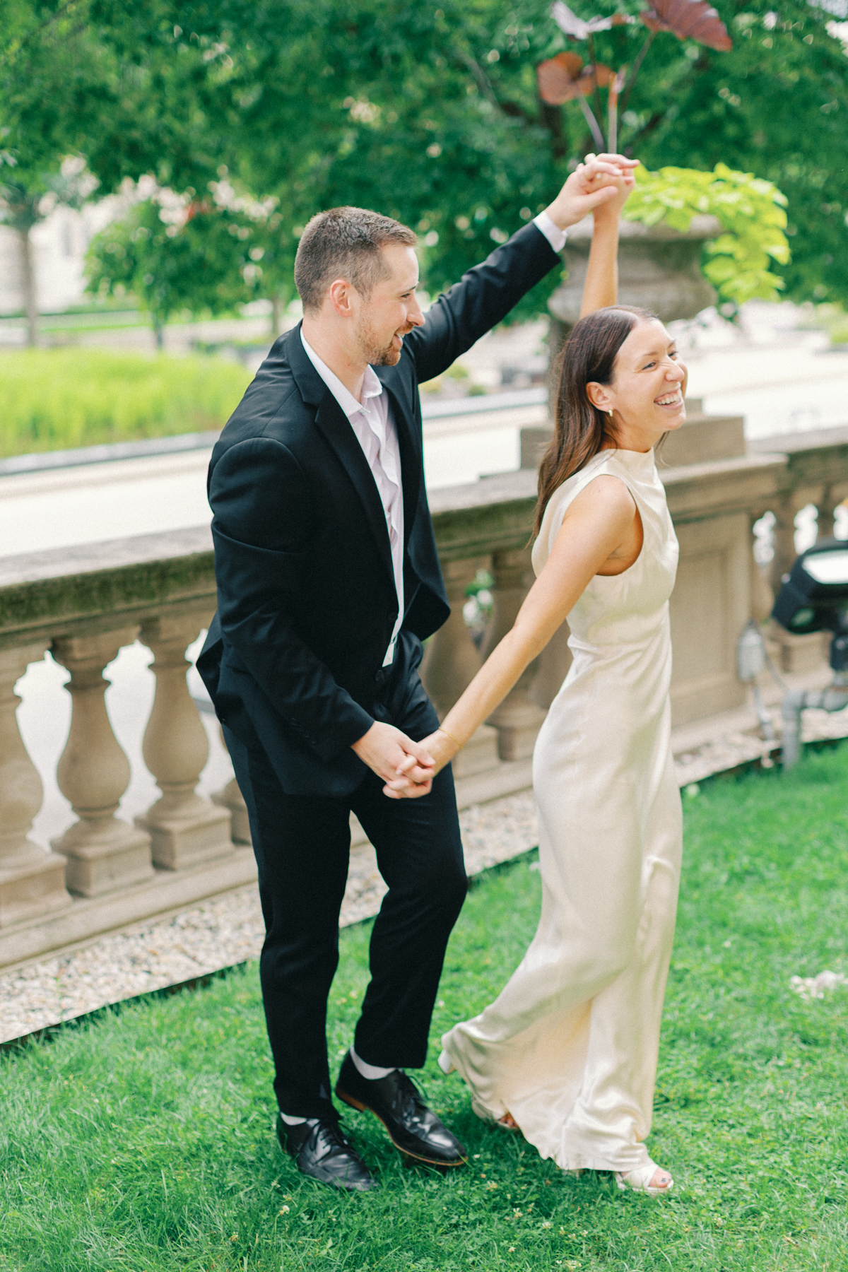 The couple holding hands and laughing