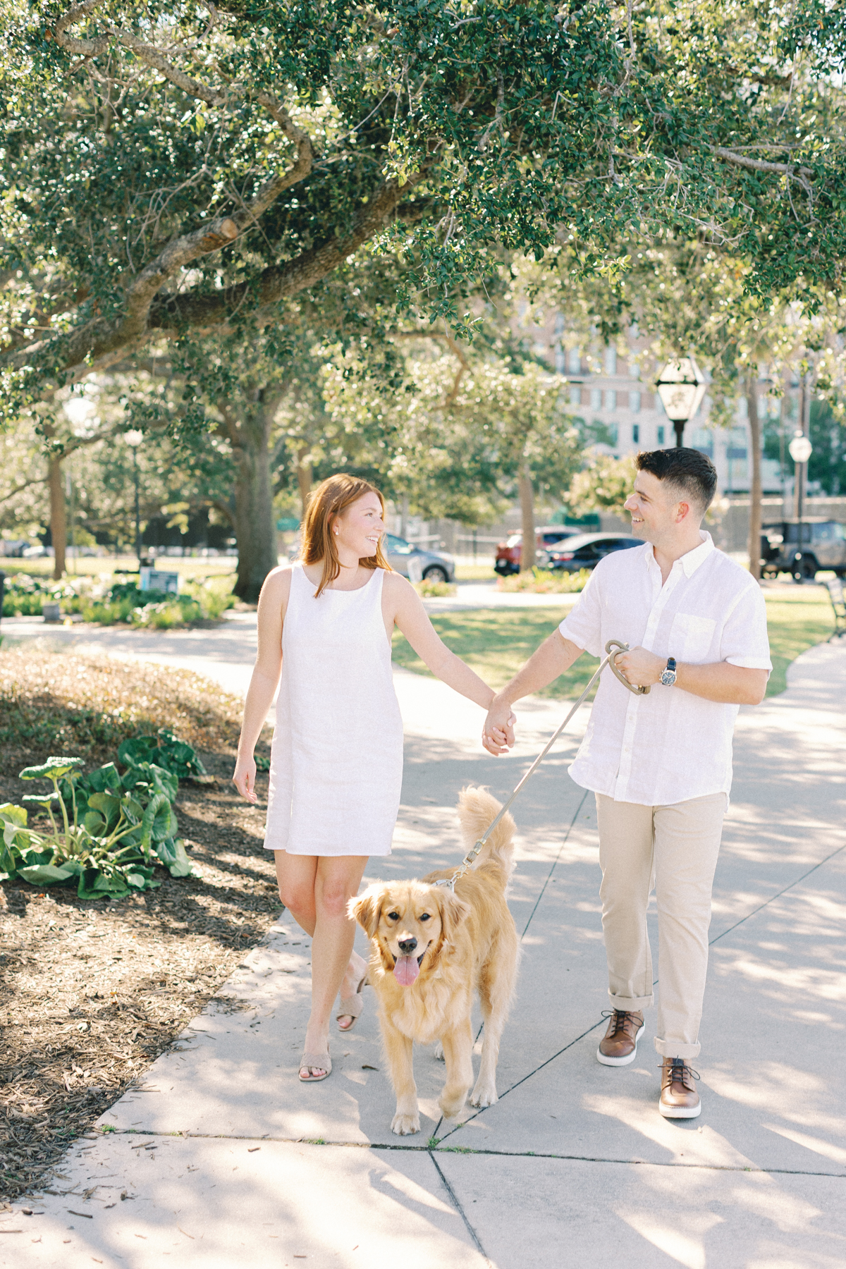 Couple walking their dog