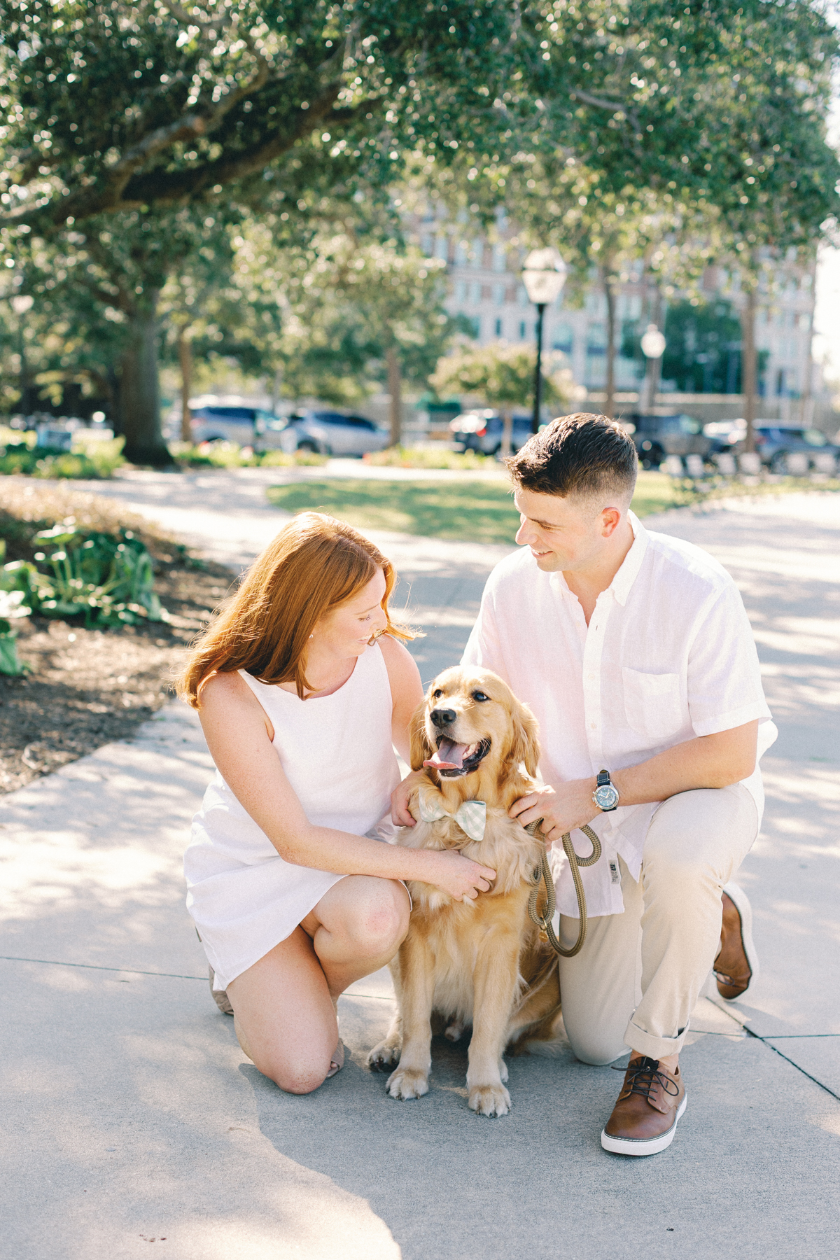 Couple looking at their dog