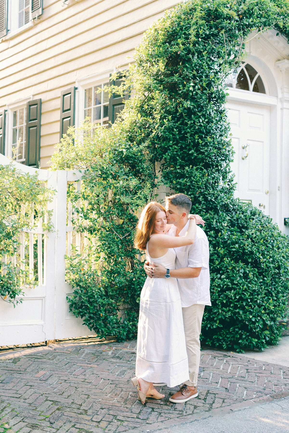(groom) kissing her