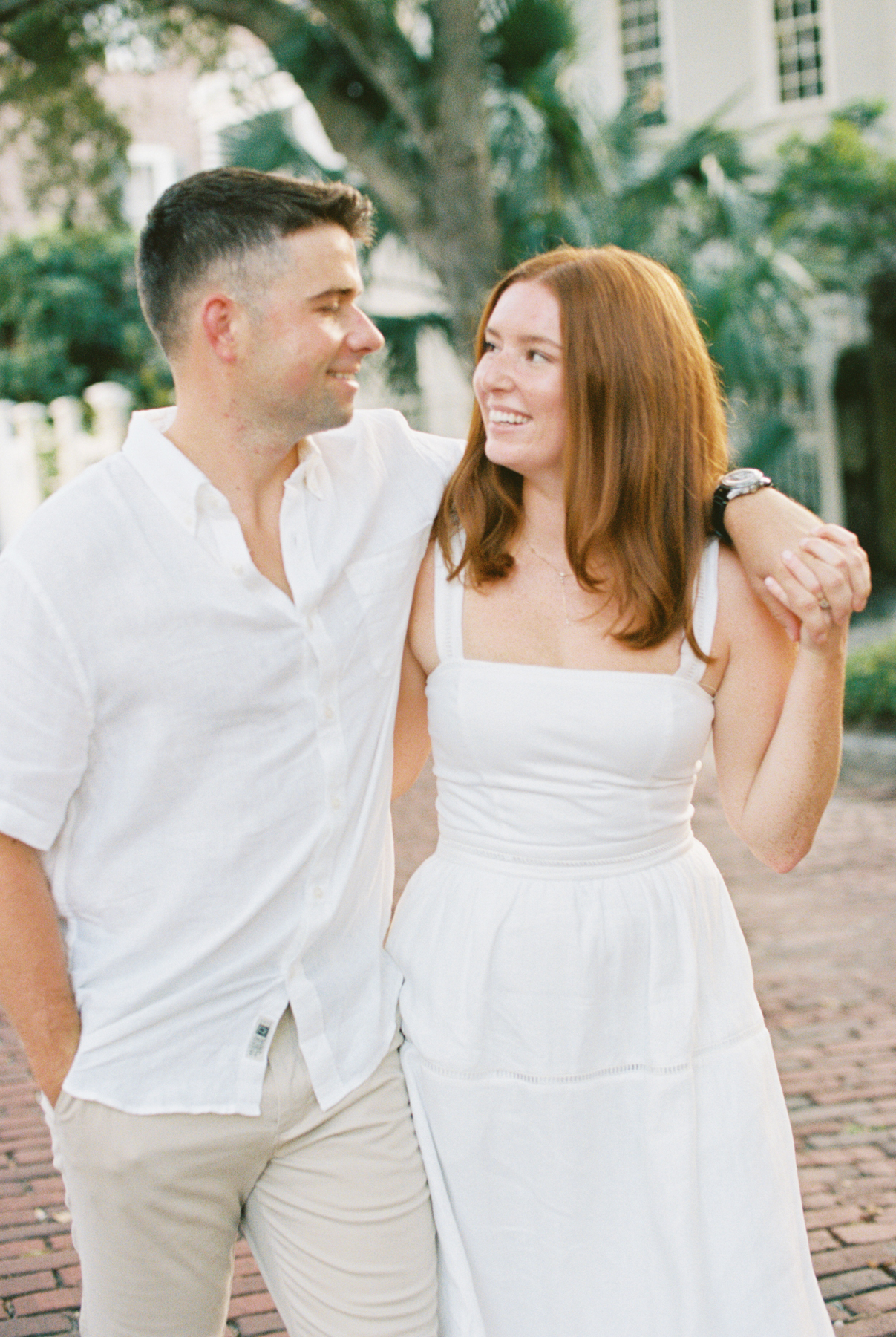 Couple stumbling laughing