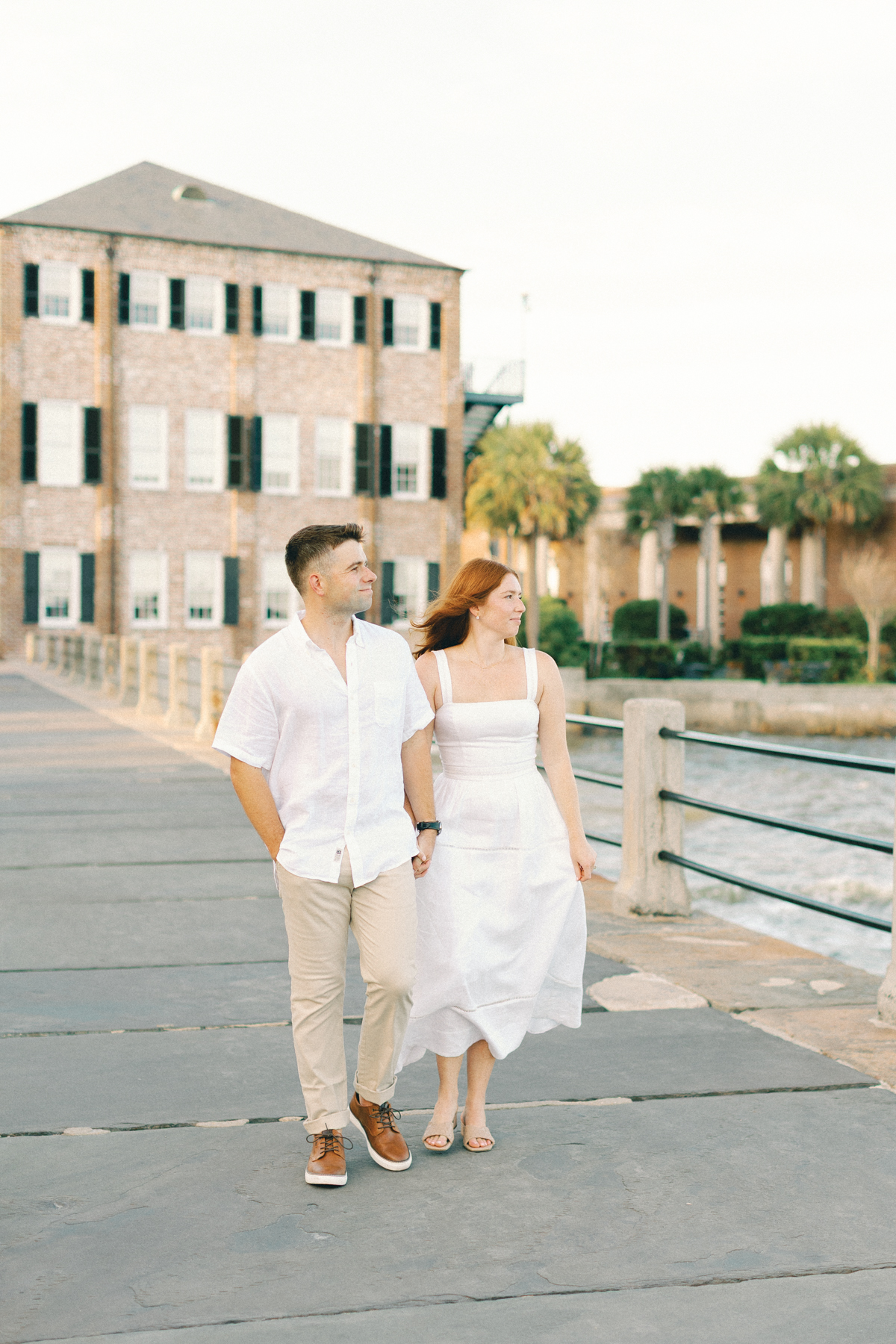Couple walking on boardwalk