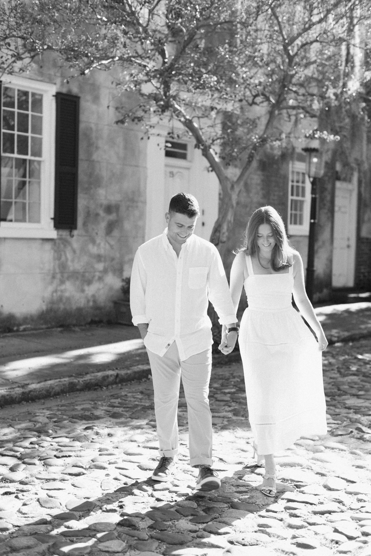 Black-and-white photo of couple walking