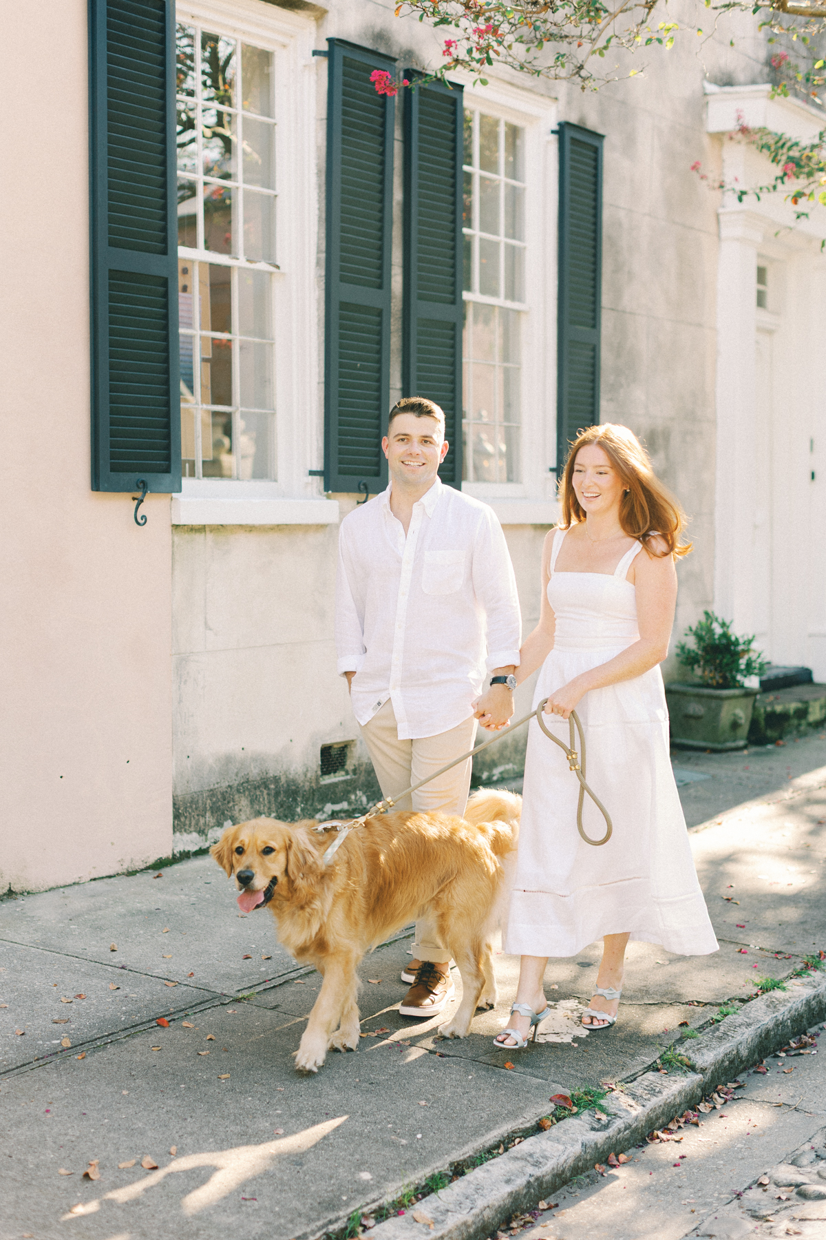 Couple walking their dog