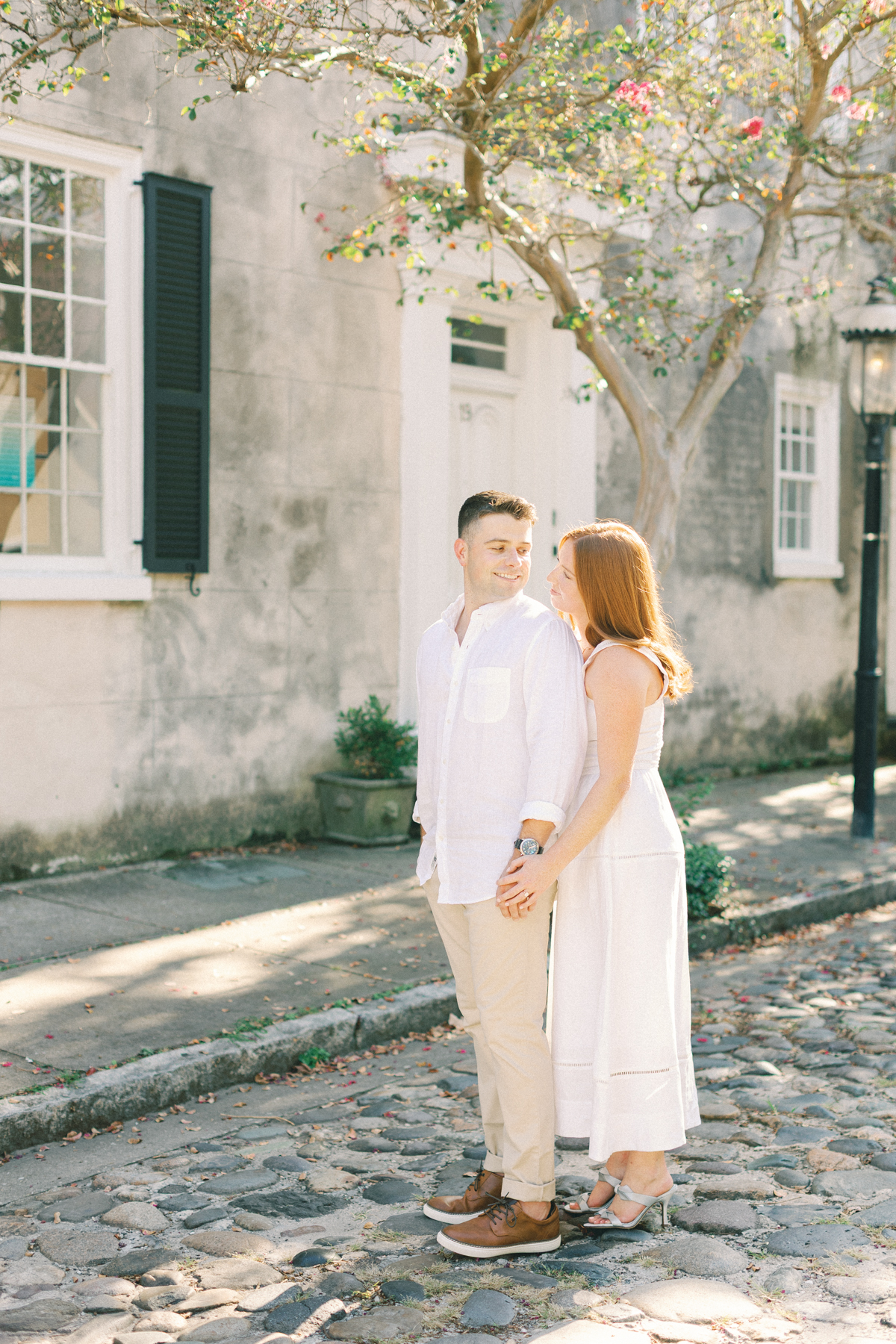 Couple looking at each other in sidewalk