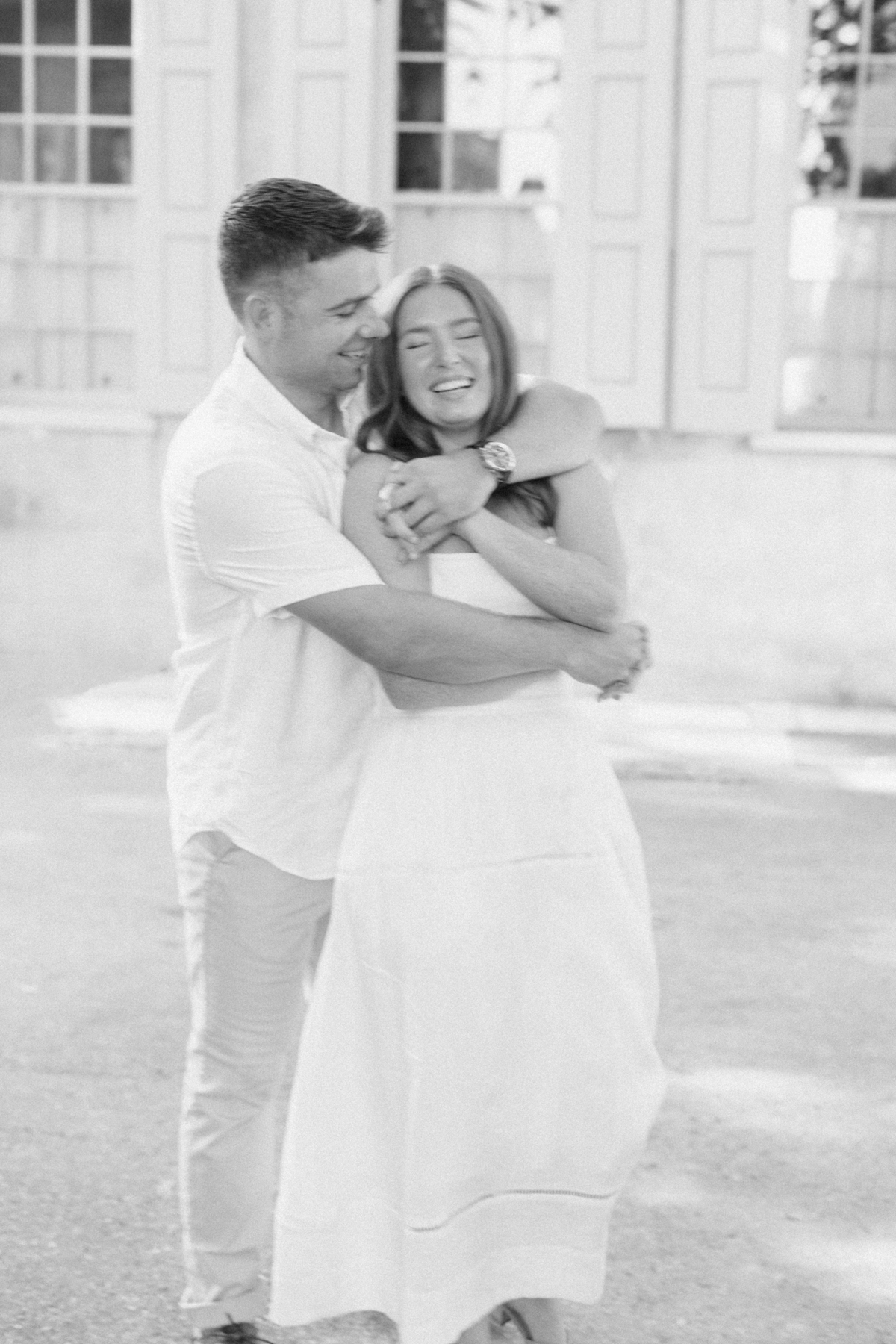 Couple laughing, black-and-white blurry