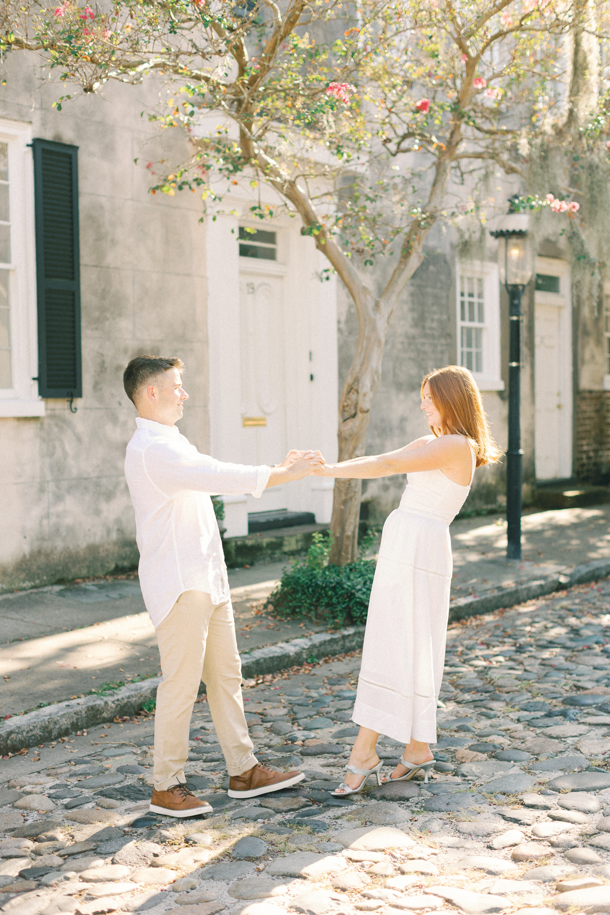 Couple spinning each other around
