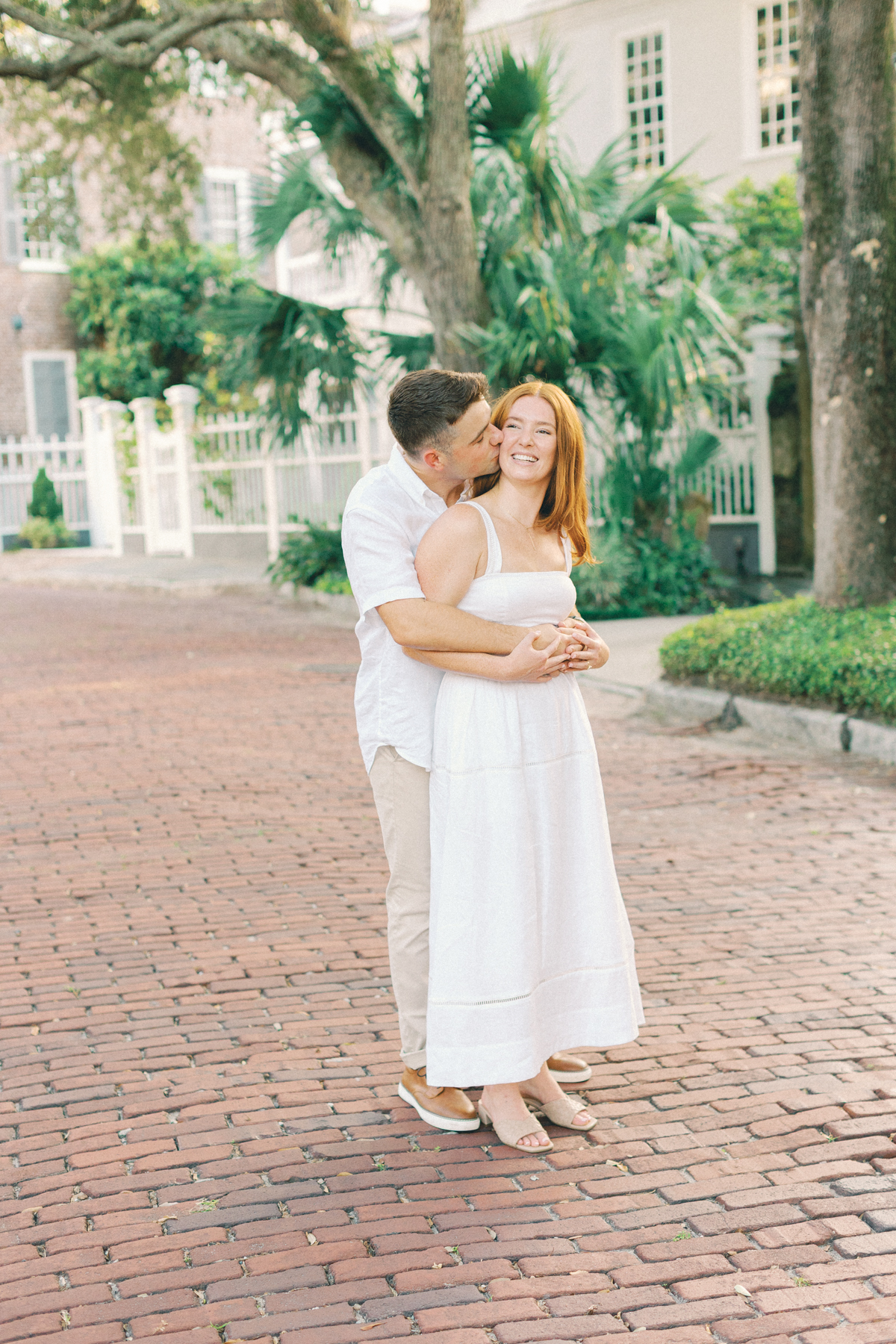 Couple snuggled up laughing