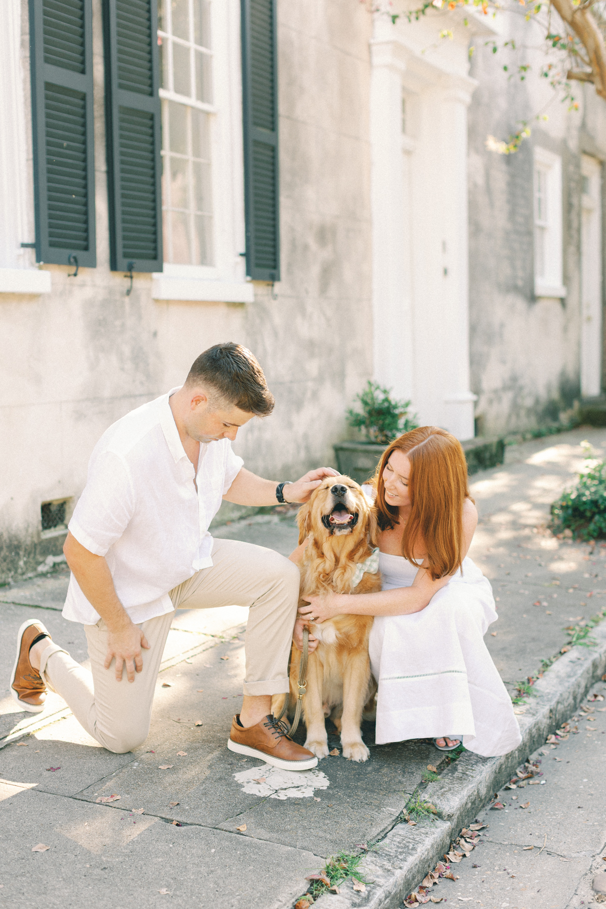 Couple playing with her dog