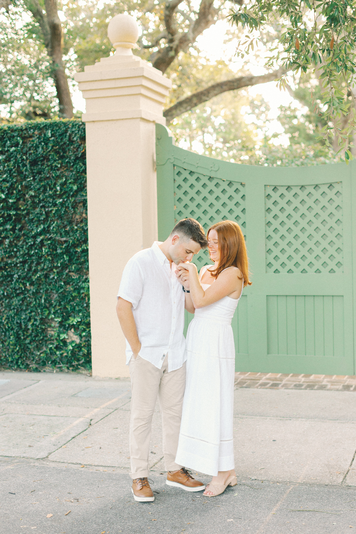 Him kissing her hand