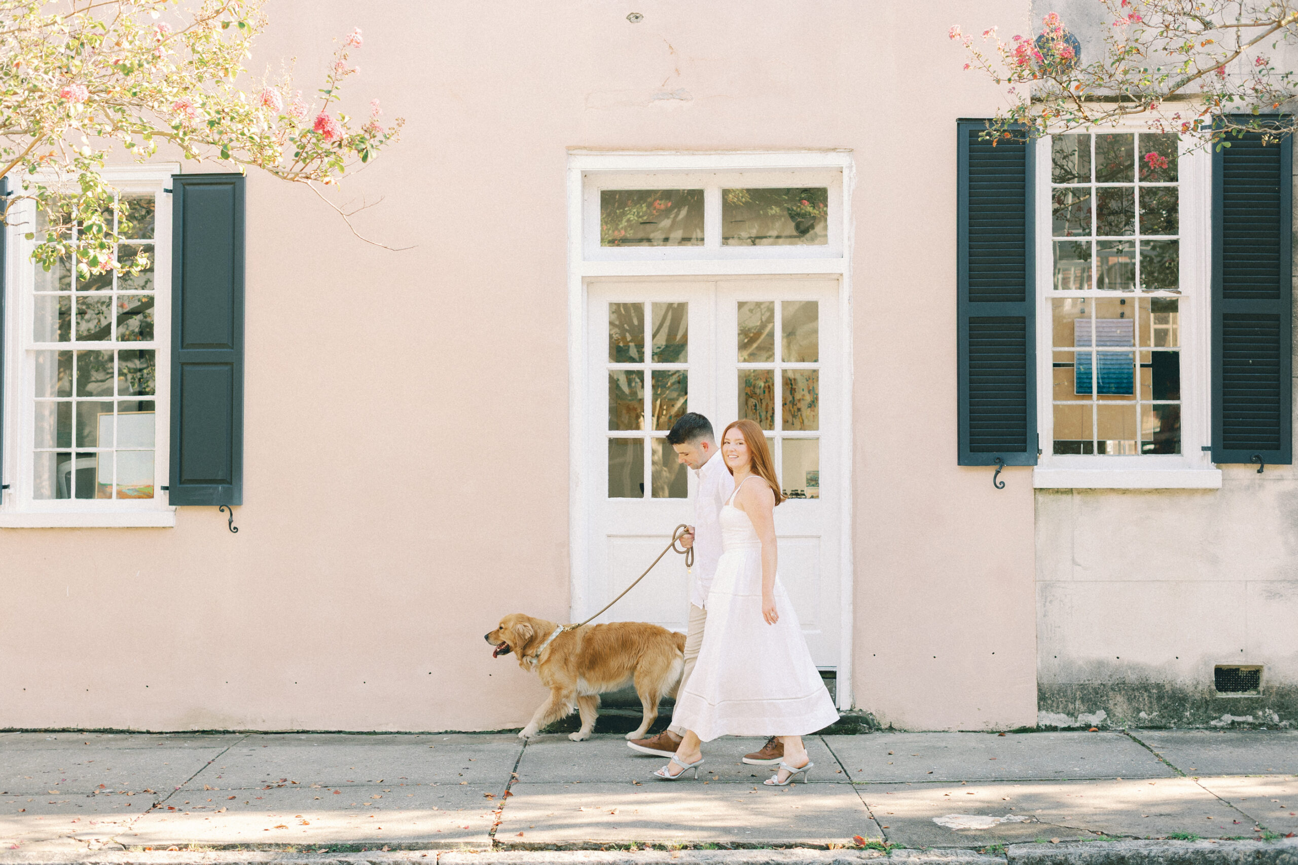 Couple walking with her dog