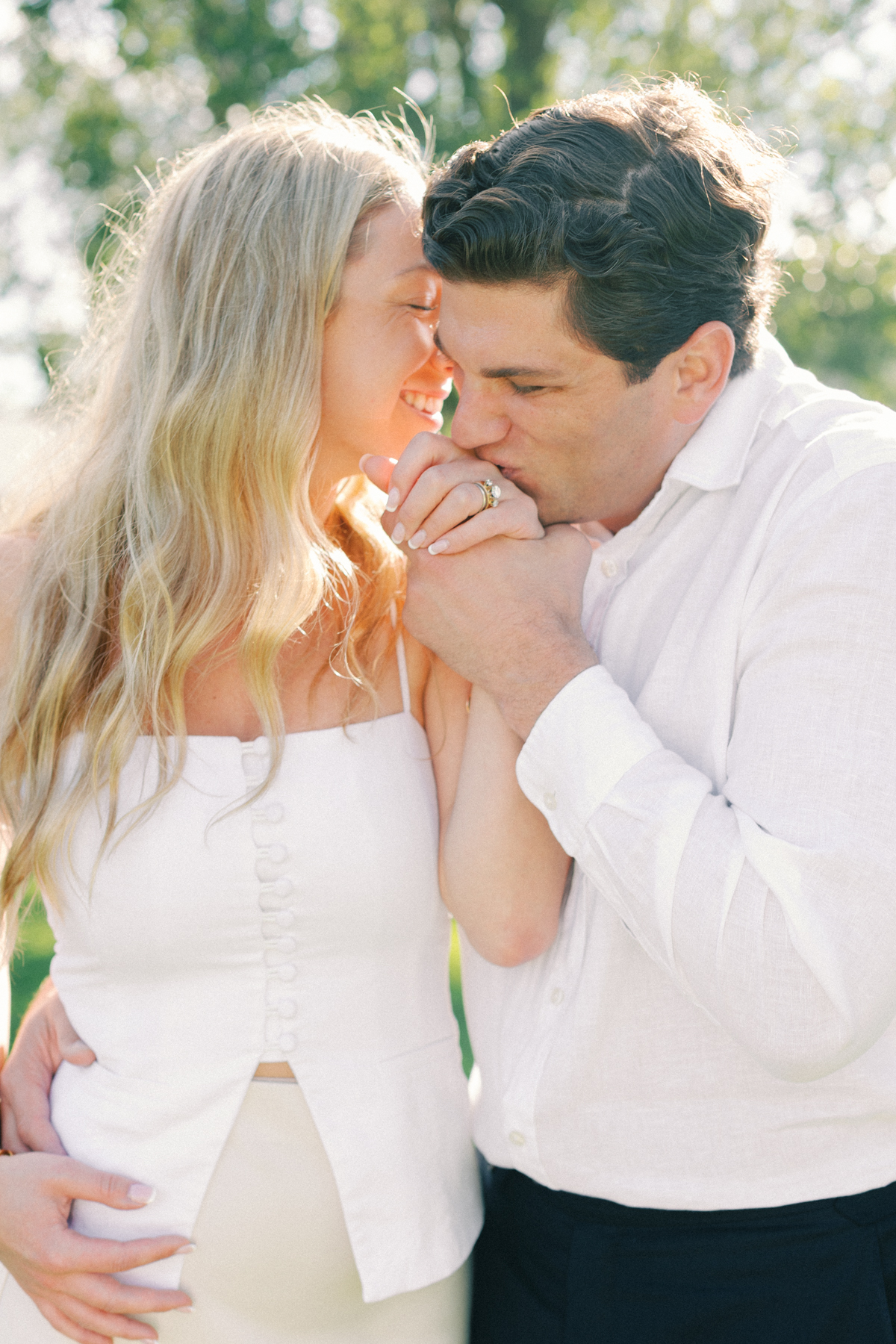 Him kissing her hand