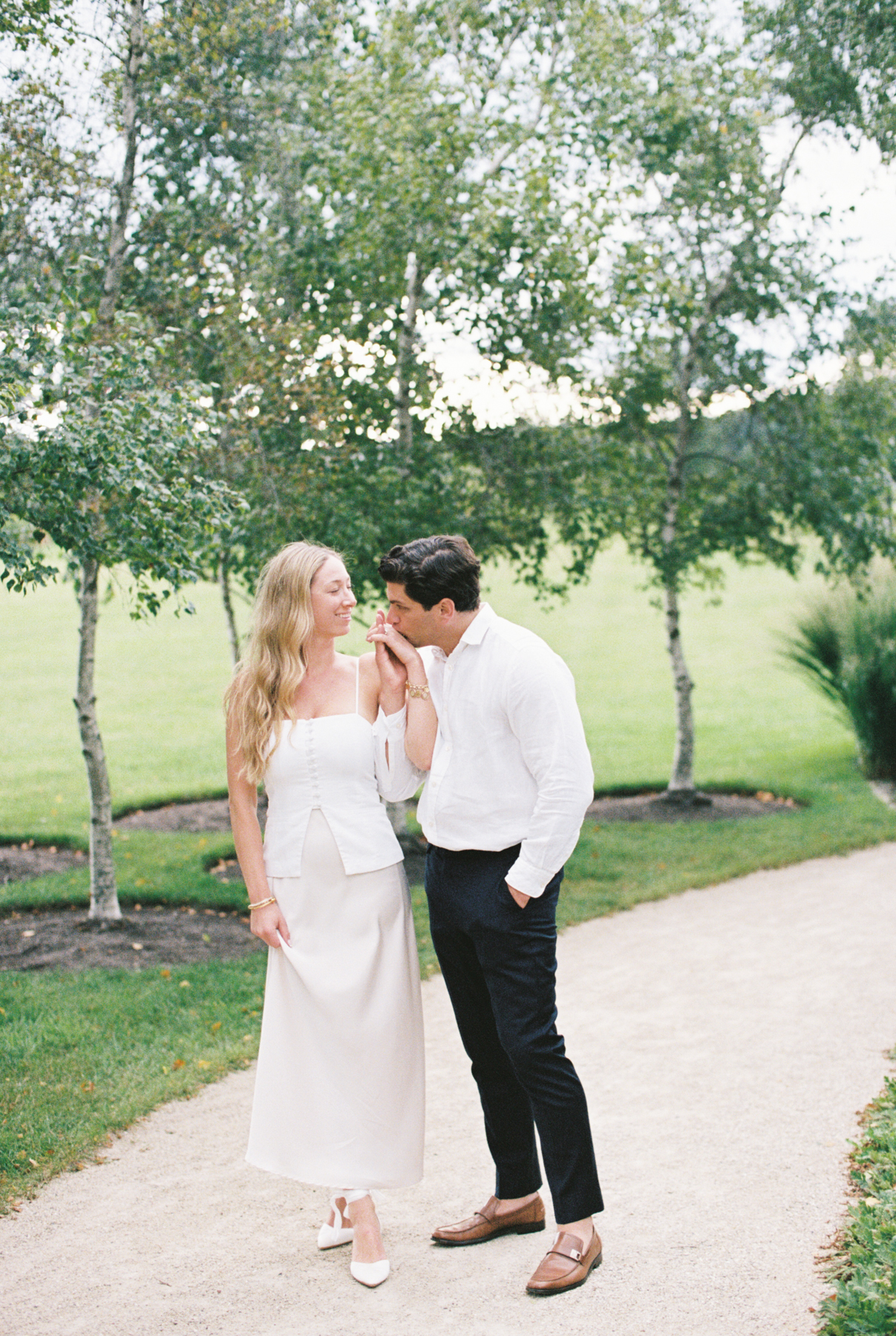 Him kissing her hand