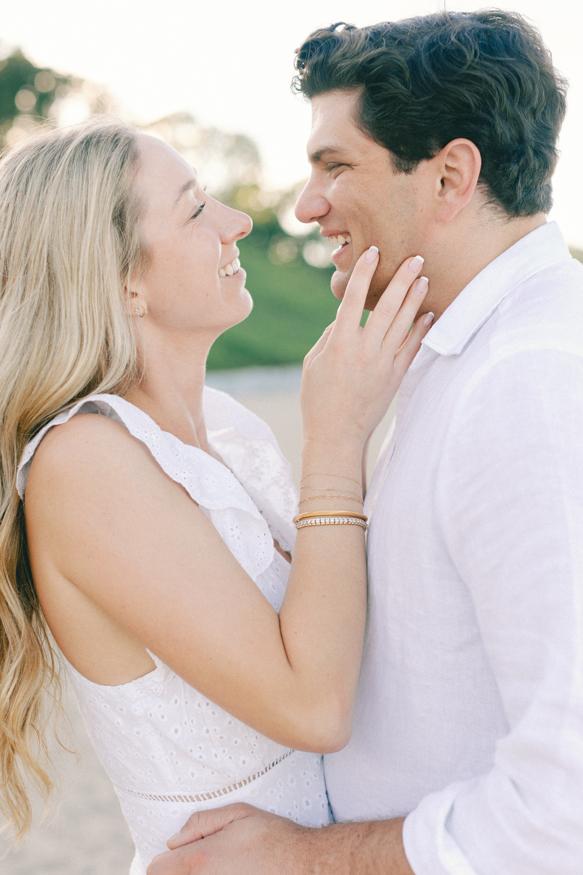 Couple almost kissing laughing