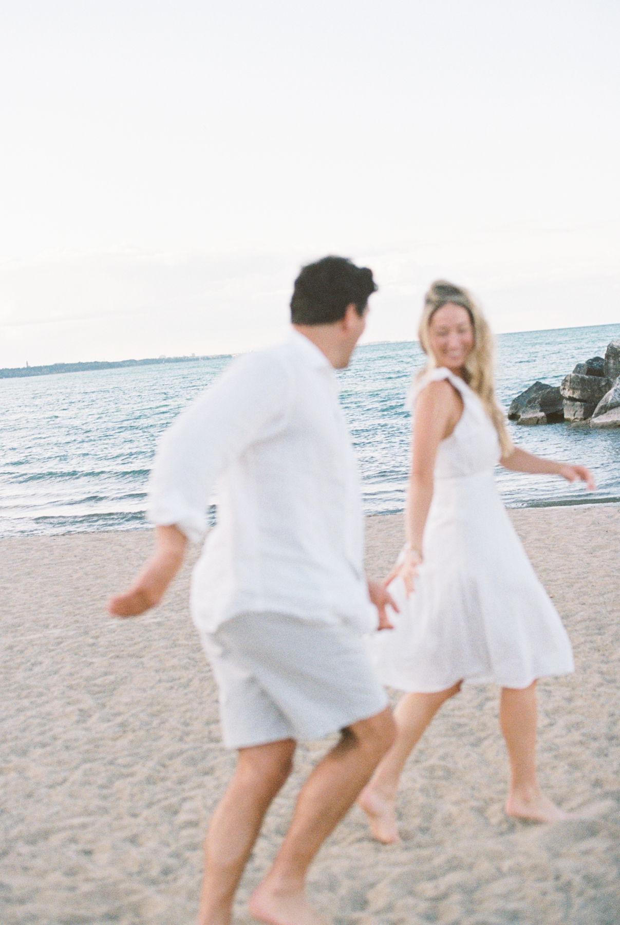 Couple chasing each each other other
