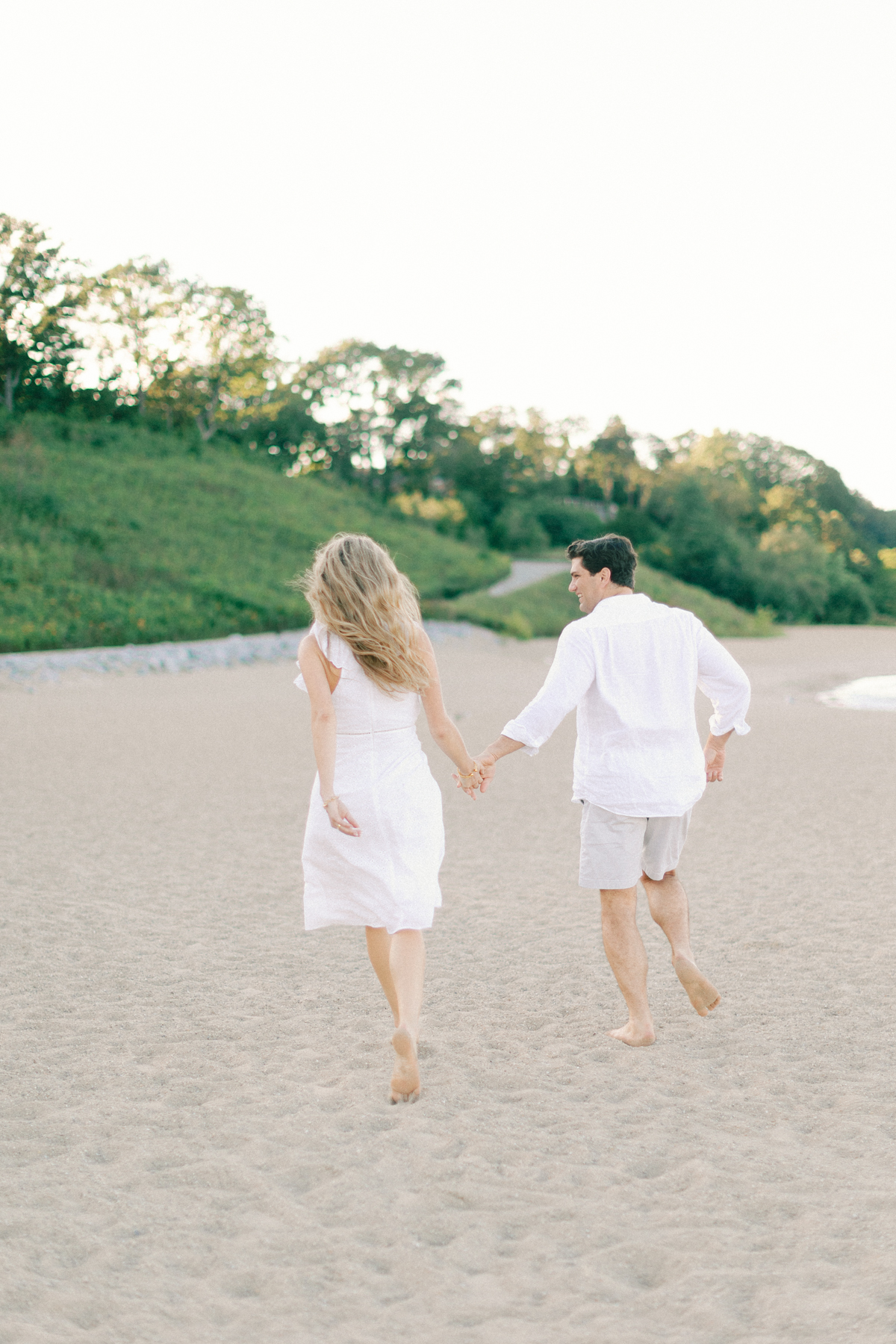 Couple running away from camera