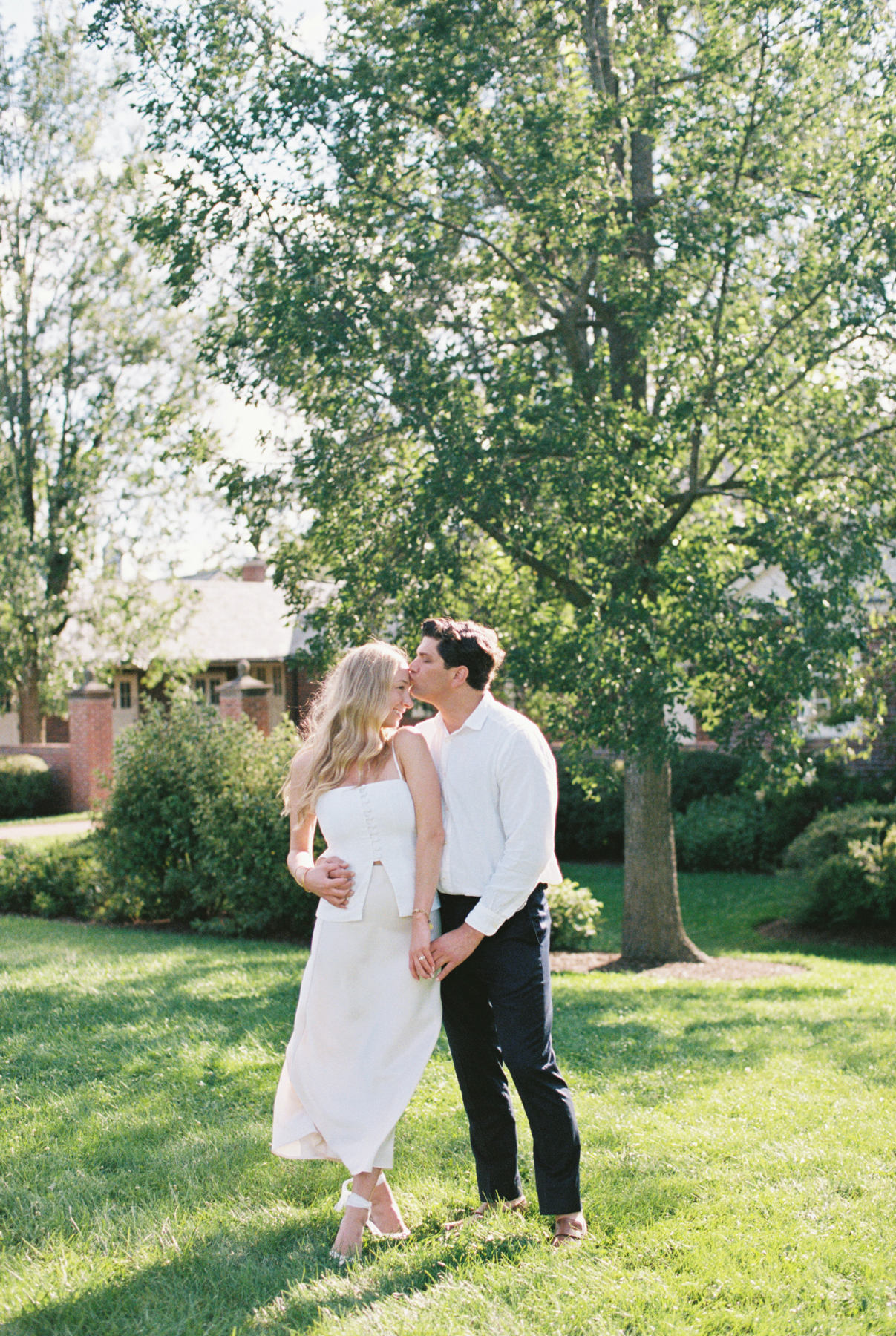 Couple kissing and garden