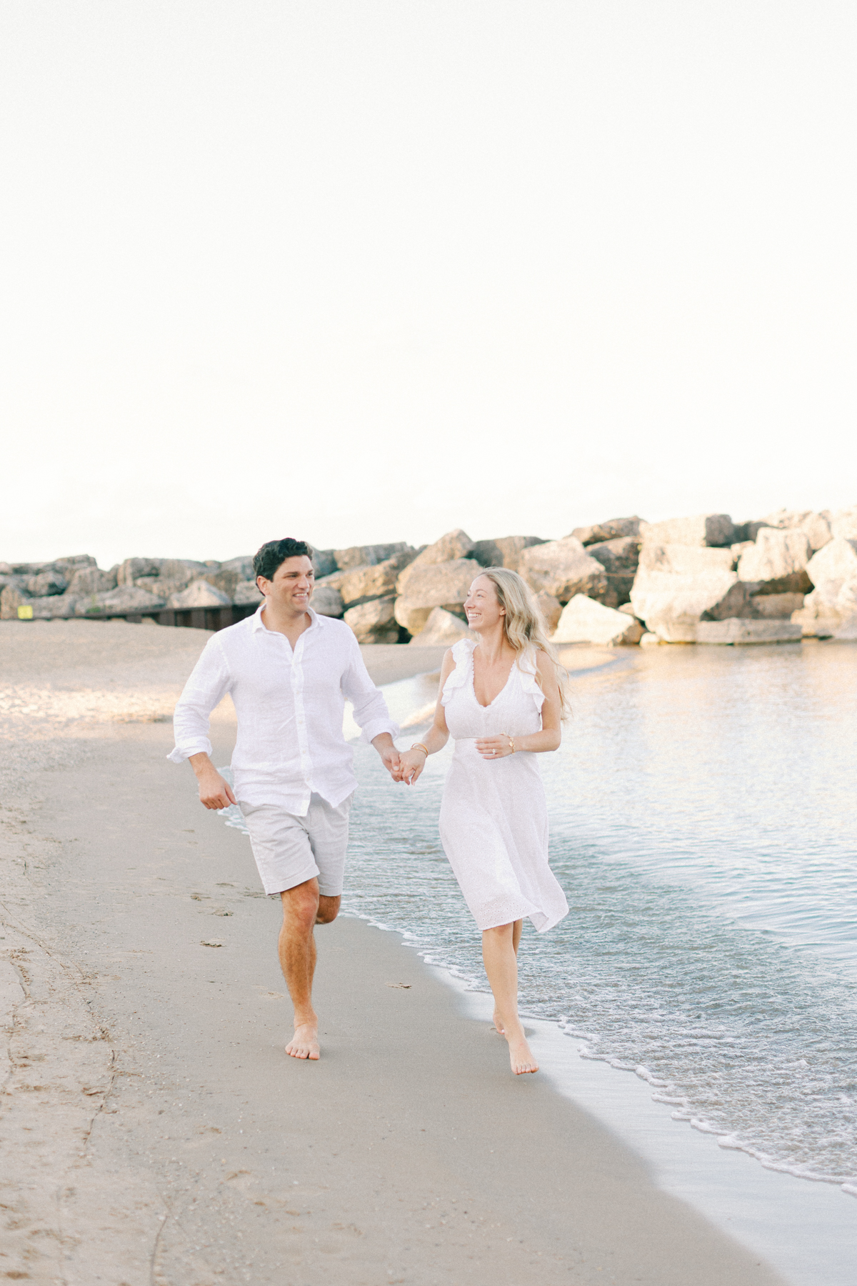 Couple running towards camera
