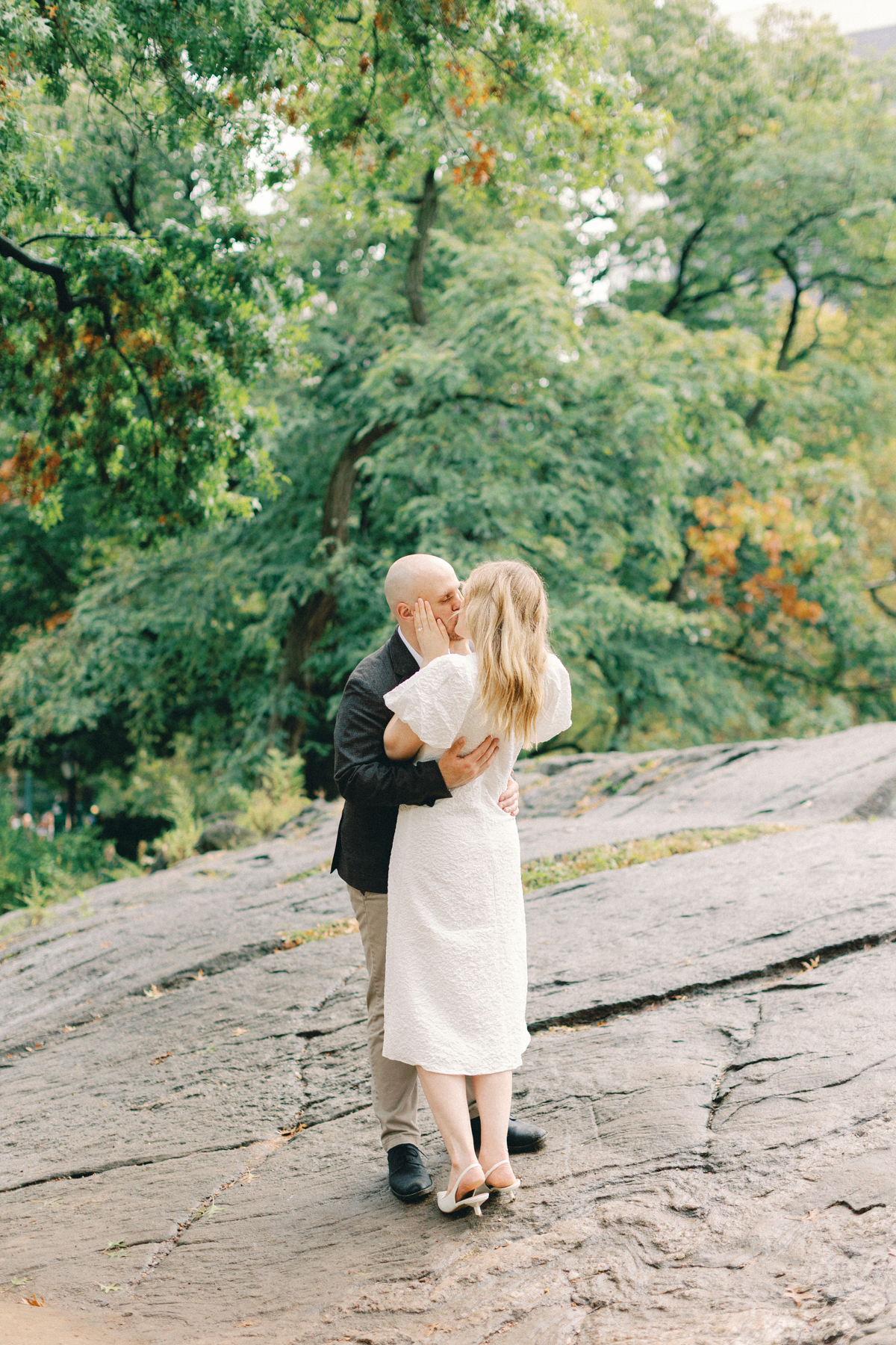 Couple kissing on rock