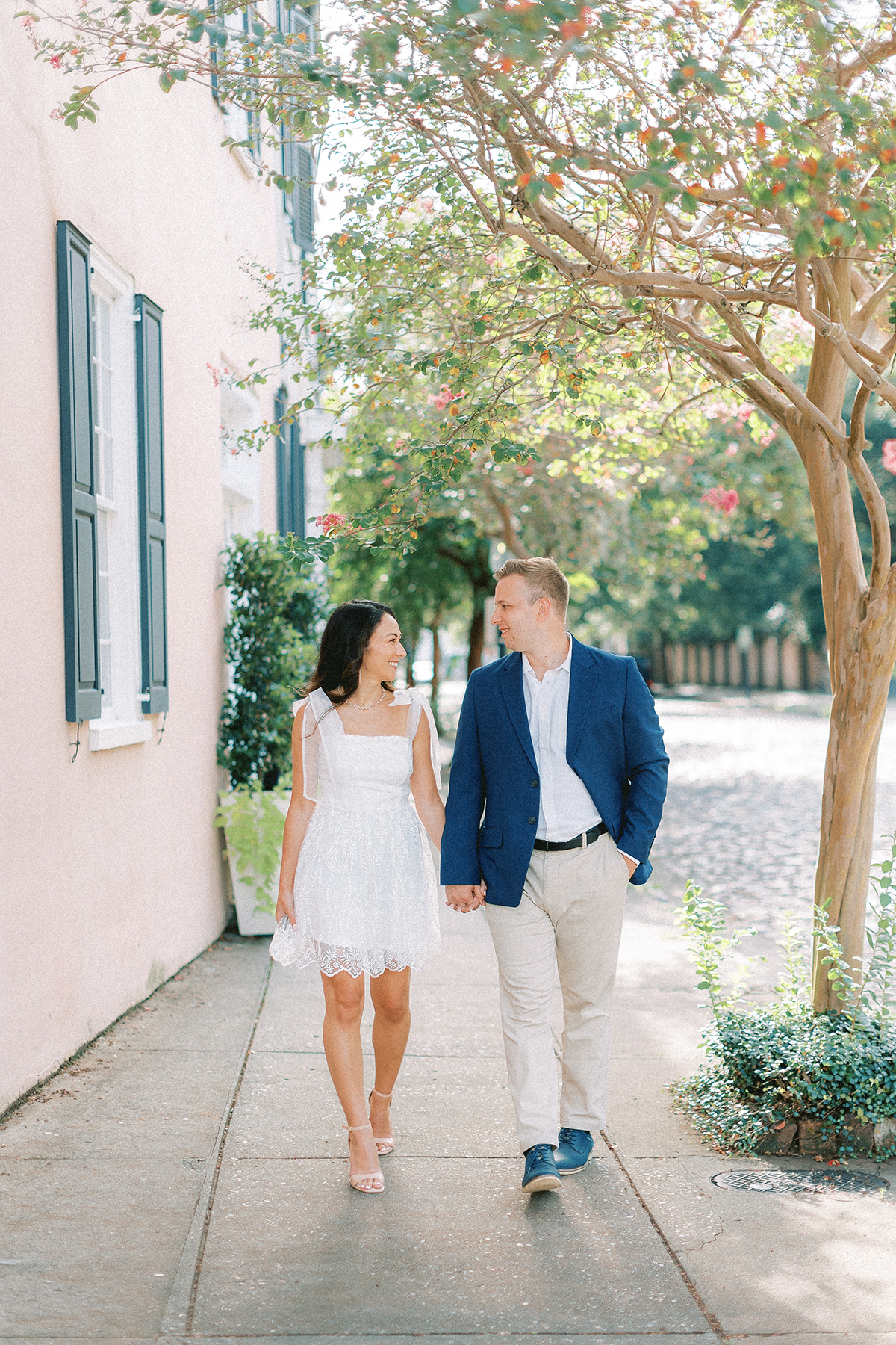 couple walking on sidewalk