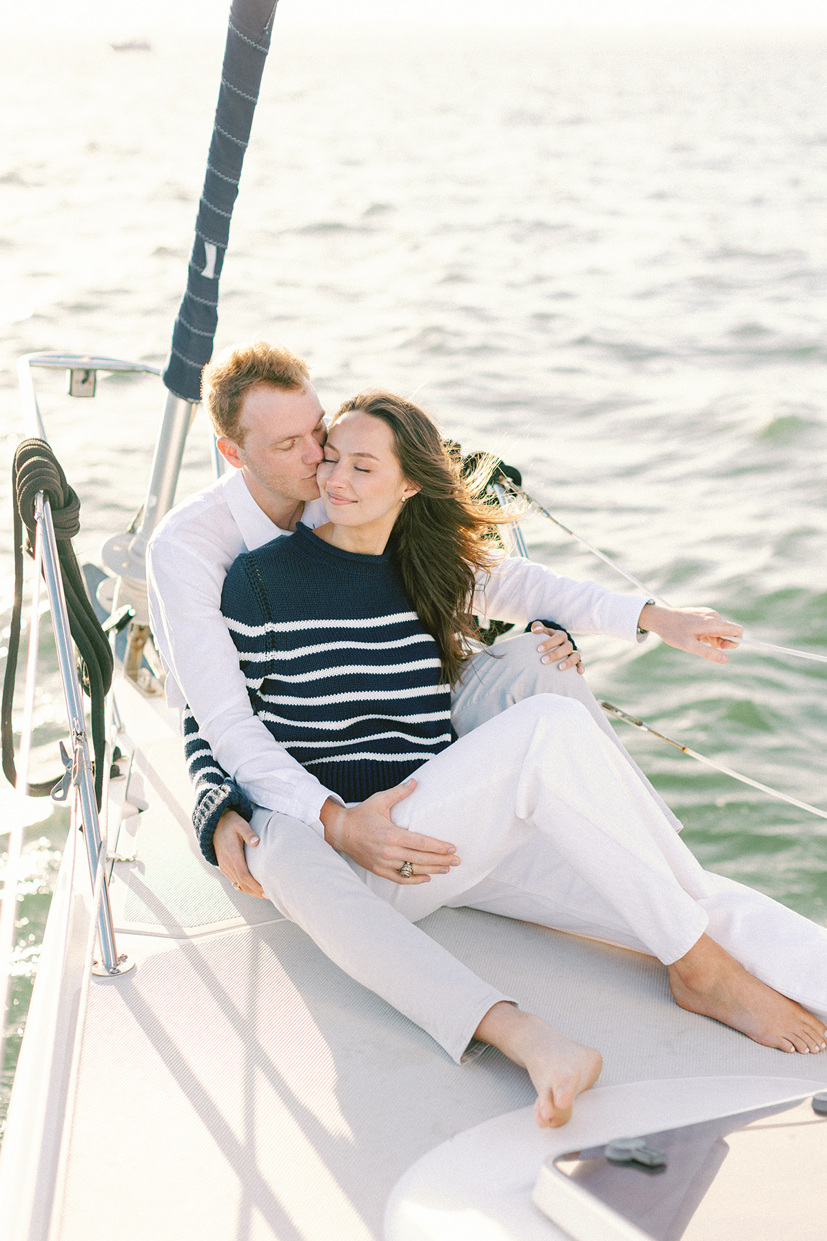 Couple kissing on sailboat