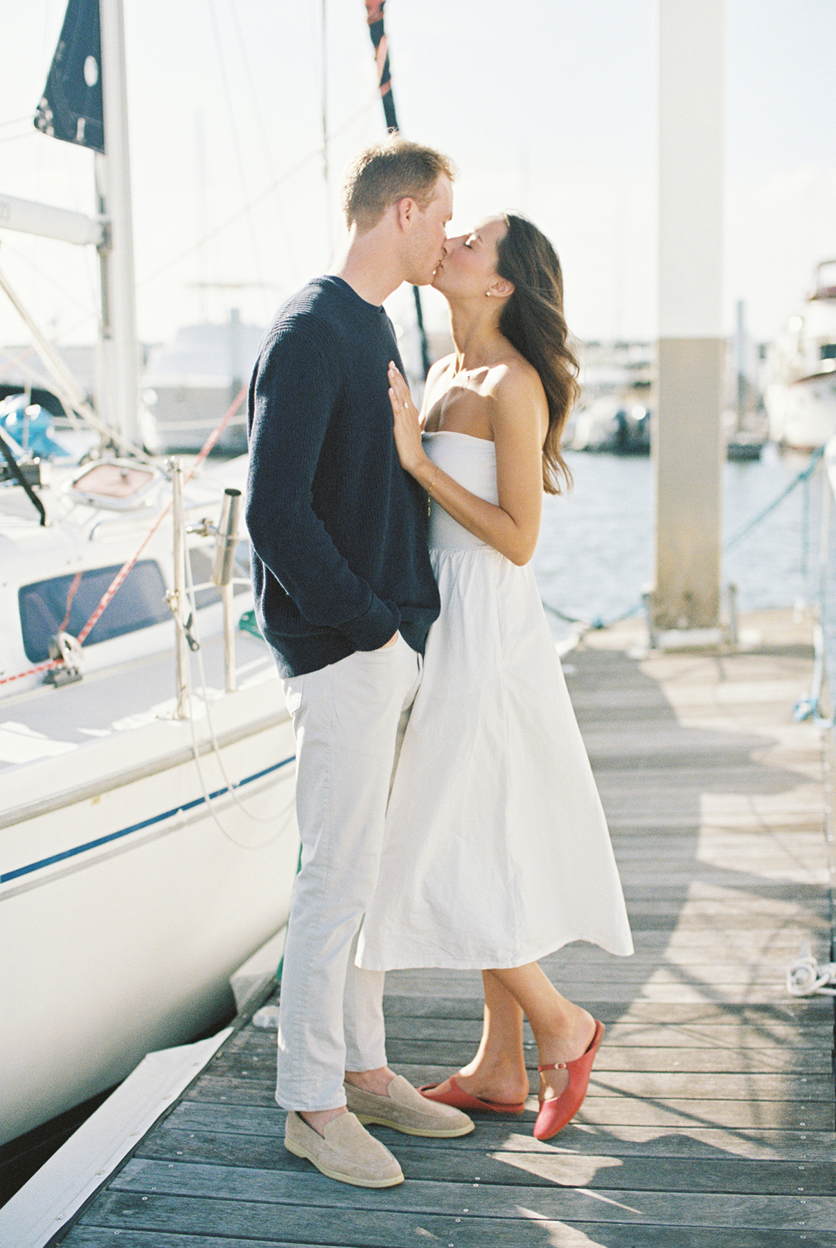 Couple kissing on pier