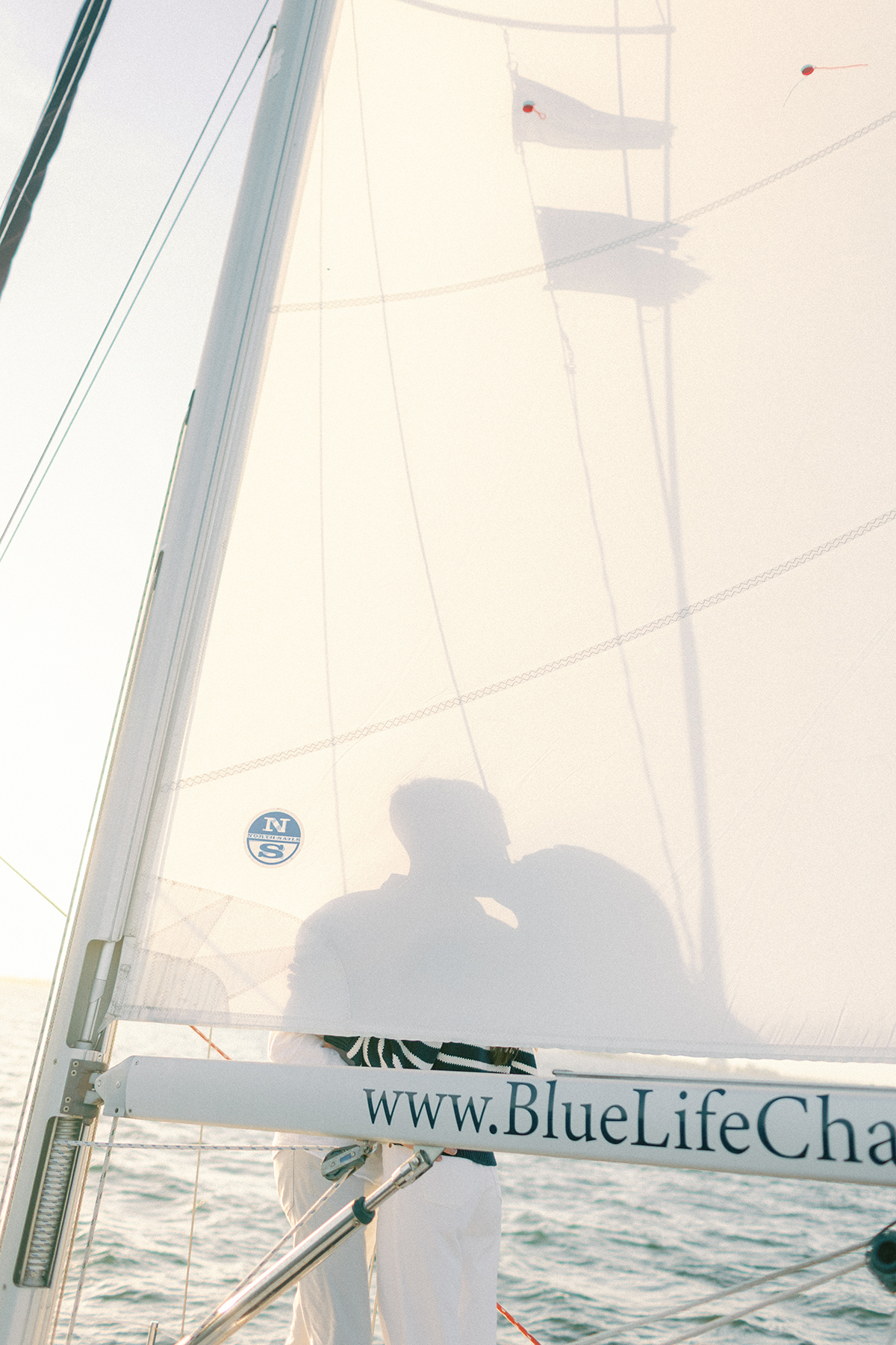 Couple silhouette on sailboat