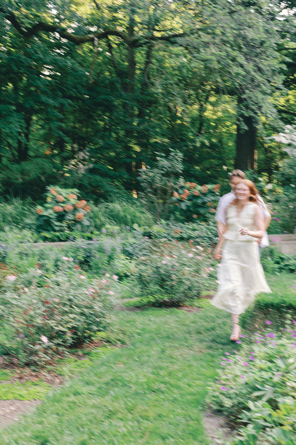 Couple chasing each other in garden
