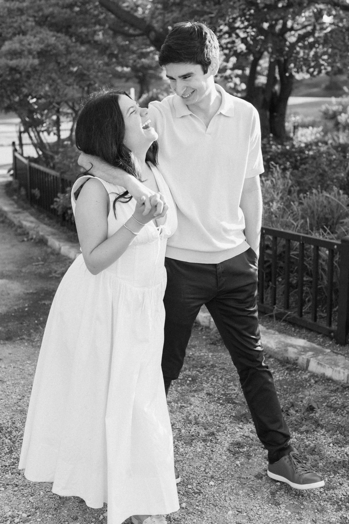 Couple laughing, black and white and park