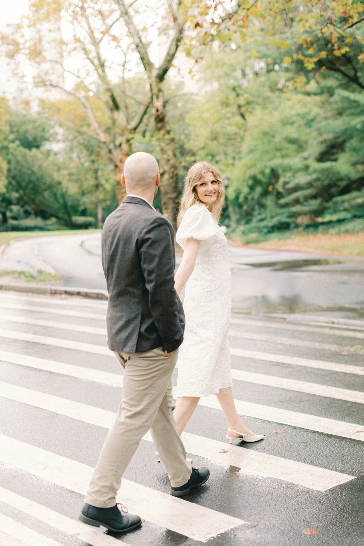 Couple crossing the road holding hands