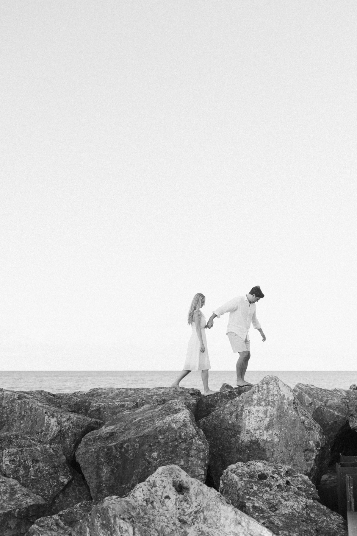 Couple walking on rocks